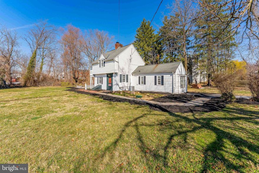 Welcome to 30 Meadowbrook Road, a charming 2-bedroom, 1.5-bathroom single-family home in Wayne. As you approach the property, you'll be welcomed by a spacious and inviting yard. Step inside the foyer, where beautiful hardwood floors and a stylish chandelier set the tone for the home. To the right, you'll find stairs leading to the upper level and a convenient coat closet. To the left, the inviting living room features hardwood floors, an electric fireplace, and a breakfast bar featuring a beautiful granite countertop with seating for three. The dining room boasts stunning hardwood floors and a large bay window, filling the room with natural light. A doorway from the dining room leads to the kitchen, where you'll find luxurious porcelain heated tile floors, sleek stainless steel appliances, granite countertops, and white cabinets with pull-out shelves and soft close doors. A walk-in pantry offers ample storage that also connects to the utility area. One step down from the kitchen, you'll find a door leading to the backyard, as well as a convenient powder room with tile floors. The main level also includes a partially finished room used as a gym. This converted garage has abundant natural light from windows, has heating and is perfect for a variety of uses. Upstairs, the primary bedroom features hardwood floors, a private balcony, and two closets. A laundry closet with a full size stacked washer and dryer is conveniently located in the hallway. The full bathroom is tastefully designed with black and white tile floors, a tub/shower combo, and a single-sink vanity. Completing the second level is the second bedroom, also with hardwood floors, offering a cozy and inviting space. Not only does this home offer incredible charm and functionality, but its location is unbeatable. Just 0.2 miles from the Strafford Train Station, you'll have easy access to commuting. Additionally, you're steps away from the Devon Square Shopping Center and a wide range of dining, shopping, and entertainment options, including the famous Devon Horse Show. This is an opportunity you won’t want to miss—make this stunning home yours today!
