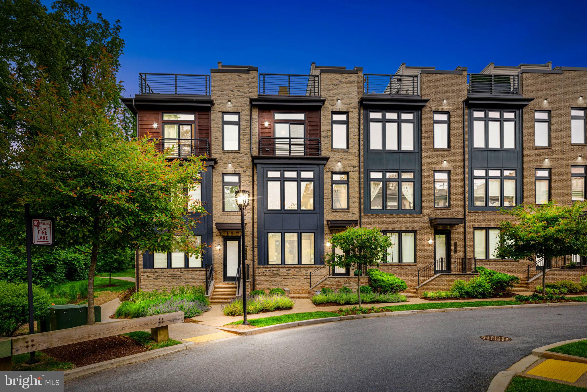 Welcome to your future haven at 142 Winsome Circle in Grosvenor Heights. This modern and inviting home is the perfect blend of comfort and convenience, spanning an impressive 3,100+ square feet, offering three spacious bedrooms, a den-library, and three and a half bathrooms, ensuring plenty of room for relaxation and entertainment. One flight up discover a bright and open main floor with 10' ceilings, a showpiece kitchen, designed to be the heart of the home, perfect for culinary adventures or hosting gatherings with its ample quartz countertop space and sleek, modern Bosch stainless steel appliances and ceiling height cabinetry, all seamlessly flowing into an expansive living area for a connected and inclusive atmosphere. Be it the front living and dining area or the rear family room with a gas fireplace and adjoining deck.
This home boasts both front and back views that fill each room with natural light, creating a warm and welcoming ambiance, while its thoughtful layout ensures privacy and maximizes space and functionality, further enhanced by a range of thoughtful upgrades designed to elevate your daily life, including Tailored Living Closets & Garage System for organized living, a rooftop Case Designed Outdoor Kitchen perfect for entertaining, a Sonos Ceiling Speaker system in the Family Room for immersive sound, Closet Factory Built-in Library and Family Room Built-ins for elegant storage, Custom Laundry Room Shelving for efficiency, an In-home WiFi Extender for seamless connectivity, and a Leaf Water Solution Filtered Water in the Kitchen Sink for convenience.
The home is appointed with an elevator with stops on all three finished levels and the fourth floor full length rooftop terrace. Enjoy the ease of access to downtown Bethesda, Wildwood Shopping Center as well as I-495 and I-270, making commuting or weekend escapes delightfully simple; whether you're hosting a get together on the rooftop or enjoying a quiet evening in the family room, this home is designed to cater to your modern lifestyle, embracing the opportunity to live in a community that combines urban conveniences with suburban tranquility. Discover the endless possibilities that await at 142 Winsome Circle—a place to call home.