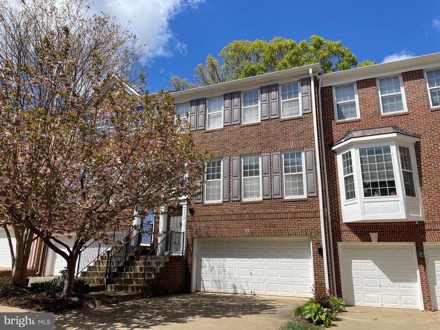 Welcome home to your private enclave close to everything you need.   This spacious town home at 2550 sq ft, has an open main level floor plan with living and dining areas, open kichen and back balcony backing to the woods.   Upstairs the elegant primary suite has a tray ceiling and spa-like bathroom including large soaking tub and separate shower stall.  Laundry is conveniently on the upper level.  Ground level has a two car garage and family room with walk out to fenced back yard.  The community includes tot lots, pool, bike/jogging paths and is very close to Vienna Metro, the Pan Am Shopping Center and convenient to routes 66/495/29/123.