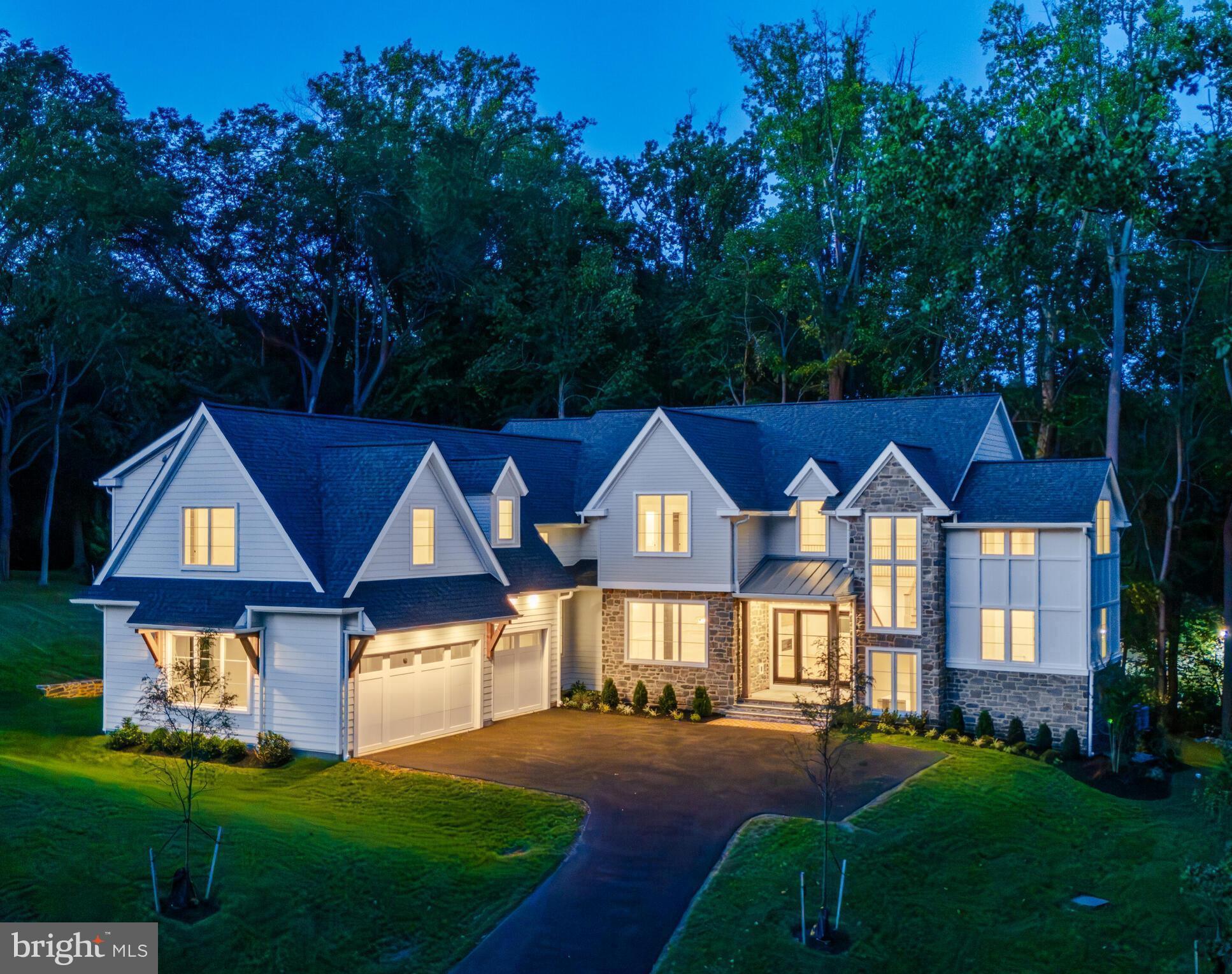 "Sandringham"- 3 new luxury home sites located in the convenient confines of the Philadelphia Main Line! A few photos of the first quick delivery home show a glimpse of the custom artistry that must be experienced to truly appreciate. Crafted by KD Building & Development, designed by McIntyre & Capron Architects, the transitional treasure is situated on a beautifully treed 1+acre home site in this exclusive Lower Merion enclave. The exquisite custom residence offers the perfect blend of privacy, luxury, and comfort within the award-winning Lower Merion School District! Nestled at the end of a scenic cul-de-sac, the transitional manor sits in a tranquil, park-like setting enhanced by mature shade trees. Exteriors showcase thermal flagstone front and rear porches, sodded yard, and flood lights. Additional impervious area allotment could be your future in-ground pool. This courtyard-style residence showcases refined craftsmanship and architectural elegance, with 5–6 bedrooms, 6 full baths, and 1 powder room across three spacious levels. The grand foyer features a soaring two-story window wall and an elegant turned staircase with white oak treads, custom railings, and metal balusters. Interiors boast site-finished, engineered ¾” X 5" white oak floors on the first and second floors; 125 interior and exterior recessed lights; 9.5" baseboard/1st floor; 7.5" baseboard/2nd floor; crown molding t/o 1st floor; and ceilings that reach 10 feet on the main level and 9 feet upstairs, many adorned with coffered or beamed treatments. The light-filled main level offers seamless flow between formal and casual living spaces, including a living room and family room with a shared see-through fireplace, an elegantly trimmed dining room, and a sunlit morning room adjacent to the gourmet kitchen and commodious family room.The chef’s kitchen is outfitted with upscale stainless-steel Thermador appliances, quartzite countertops, tile backsplash, pot filler, custom Kountry Kraft cabinetry, under-cabinet lighting, walk-in service pantry, butler’s pantry, and wet bar. A spacious study with a full bath and closet functions perfectly as a first-floor bedroom guest suite if needed. A generous mudroom w/built-ins, powder rm, and rear stairs completes the main level. Upstairs, the luxurious primary suite includes a sitting room (or your creative use of office/designer additional closet/vanity/retreat), walk-in closet/dressing area with custom built-ins, and a spa-like bath featuring a dramatic volume ceiling, heated designer tile floor, garden tub, stone-topped double vanity, and oversized shower with dual shower systems. Bedrooms 2 (with volume ceiling) and 3 include en-suite baths and walk-in closets, while spacious Bedrooms 4 and 5 share a large Jack-and-Jill bath. A 2nd floor laundry room with custom cabinetry, granite counters, and laundry sink offers everyday convenience. The full, well-windowed, walk-out lower level includes approximately 1,000 square feet of finished flex space, a full bath, and abundant storage with room for future expansion. This exceptional property combines unequaled construction specifications and timeless architecture with superior finishes. It sits just minutes from vibrant center city Philadelphia and Main Line village shops, dining, major commuter routes and train. Your gracious, transitional, dream home awaits! **Taxes shown are not correct. With new construction, assessment occurs post settlement to include the lot and improvements.** All renderings/floor layouts/lot plan art are artist interpretations of the plans. They are not exact, and are subject to errors, omissions and changes.