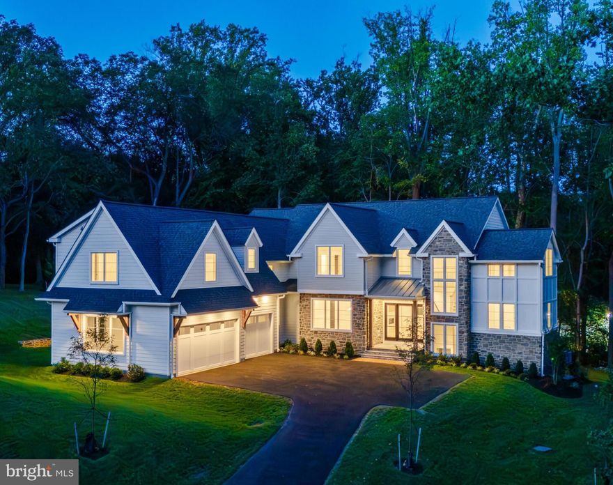 Hurry to see "Sandringham"- 3 new luxury home sites located in the convenient confines of the Philadelphia Main Line! Please take a look at a few photos of the first quick delivery home which show a glimpse of the custom artistry that must be experienced to truly appreciate. Crafted by KD Building & Development, designed by McIntyre & Capron Architects, the transitional treasure is situated on a beautifully treed 1+acre home site in this exclusive Lower Merion enclave. The exquisite custom residence offers the perfect blend of privacy, luxury, and comfort within the award-winning Lower Merion School District! Nestled at the end of a scenic cul-de-sac, the transitional manor sits in a tranquil, park-like setting enhanced by mature shade trees. Exteriors showcase thermal flagstone front and rear porches, sodded yard, and flood lights. Additional impervious area allotment could be your future in-ground pool. This courtyard-style residence showcases refined craftsmanship and architectural elegance, with 5–6 bedrooms, 6 full baths, and 1 powder room across three spacious levels. The grand foyer features a soaring two-story window wall and an elegant turned staircase with white oak treads, custom railings, and metal balusters. Interiors boast site-finished, engineered ¾” X 5" white oak floors on the first and second floors; 125 interior and exterior recessed lights; 9.5" baseboard/1st floor; 7.5" baseboard/2nd floor; crown molding t/o 1st floor; and ceilings that reach 10 feet on the main level and 9 feet upstairs, many adorned with coffered or beamed treatments. The light-filled main level offers seamless flow between formal and casual living spaces, including a living room and family room with a shared see-through fireplace, an elegantly trimmed dining room, and a sunlit morning room adjacent to the gourmet kitchen and commodious family room.The chef’s kitchen is outfitted with upscale stainless-steel Thermador appliances, quartzite countertops, tile backsplash, pot filler, custom Kountry Kraft cabinetry, under-cabinet lighting, walk-in service pantry, butler’s pantry, and wet bar. A spacious study with a full bath and closet functions perfectly as a first-floor bedroom guest suite if needed. A generous mudroom w/built-ins, powder rm, and rear stairs completes the main level. Upstairs, the luxurious primary suite includes a sitting room (or your creative use of office/designer additional closet/vanity/retreat), walk-in closet/dressing area with custom built-ins, and a spa-like bath featuring a dramatic volume ceiling, heated designer tile floor, garden tub, stone-topped double vanity, and oversized shower with dual shower systems. Bedrooms 2 (with volume ceiling) and 3 include en-suite baths and walk-in closets, while spacious Bedrooms 4 and 5 share a large Jack-and-Jill bath. A 2nd floor laundry room with custom cabinetry, granite counters, and laundry sink offers everyday convenience. The full, well-windowed, walk-out lower level includes approximately 1,000 square feet of finished flex space, a full bath, and abundant storage with room for future expansion. This exceptional property combines unequaled construction specifications and timeless architecture with superior finishes. It sits just minutes from vibrant center city Philadelphia and Main Line village shops, dining,  major commuter routes and train. Your gracious, transitional, dream home awaits! **Taxes shown are not correct. With new construction, assessment occurs post settlement to include the lot and improvements.** All renderings/floor layouts/lot plan art are artist interpretations of the plans. They are not exact, and are subject to errors, omissions and changes.