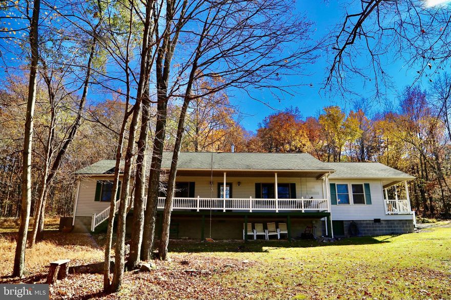 4BD/2.5BA on 4.21 acres, tucked away in a quiet, reserved neighborhood placed right next to Lost River, WV, you will find this cozy hidden gem. Privacy will not be an issue for you in this neighborhood! Make this your get-away vacation home or a permanent place to relax enjoying Fiber-Optic High Speed internet while working from home. Nature is in abundance here with wildlife at your doorsteps. Outside you will find a beautiful well kept yard, a garden/tool shed for storage, circular driveway, a very large front porch to relax and enjoy watching the gorgeous sun set behind your Mountain View,  a perfect sized porch off the Primary Bedroom with views, and there is also  a convenient 60 amp camper/electric car hookup on site! Inside you will find a well laid out floor plan with a private, large Primary Suite, 3 other large Bedrooms and plenty of natural light in a very spacious Dining Room and Kitchen with matching stainless steel appliances. There is a convenient Pantry(with extra stainless steel fridge)/Utility Room off of the kitchen adding extra storage. Only 2 hours from Washington, DC. 30min from Wardensville, WV with shopping and dining and organic farmers market. Only 15 minutes from Lost River Valley and 20 minutes from the Lost River State Park. Check out our VIRTUAL TOUR and make an appointment today!