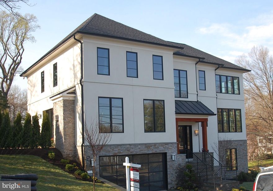 Spectacular price for this New Contemporary  with stone and (real) stucco exterior and a flowing open interior. Formal Conservatory with 12' ceilings and dramatic granite wall with linear fireplace. Perfect Kitchen, large Morning Room and Family Room open to an amazing patio and fire-pit through 10' glass doors. Resort style Master Bath and huge walk-in closet. Main Level sunny private Office, bonus room on the bedroom Level. Original design- truly unique. Built by TJO Company.  Professionally landscaped with outdoor lighting, best quality throughout.