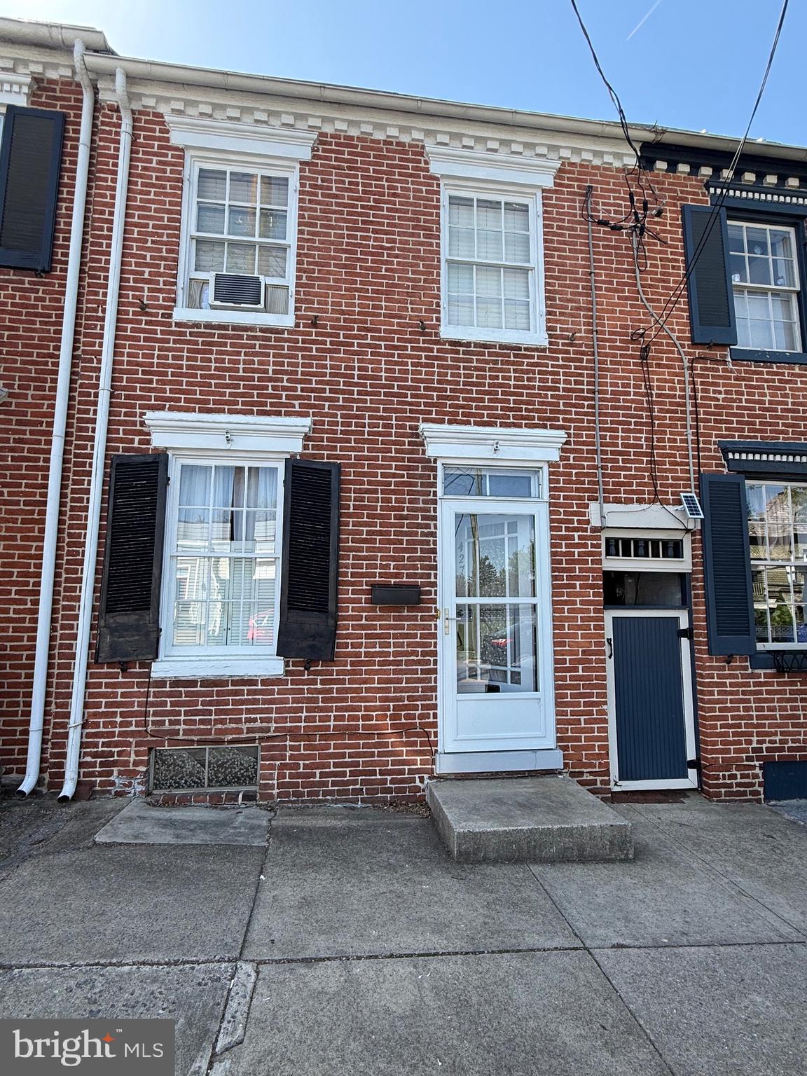Welcome to this inviting 3-bedroom, 1-bathroom townhouse nestled in the vibrant heart of Downtown Frederick. Blending character with comfort, this home offers a warm and welcoming atmosphere, perfect for both relaxing and entertaining.
Step into the spacious living room, featuring cozy carpet underfoot—ideal for curling up after a long day. The rest of the home boasts beautiful hardwood flooring, adding a touch of timeless elegance throughout.
Enjoy your morning coffee or unwind in the evening on the private balcony, or step outside to the back patio—perfect for small gatherings or simply enjoying the outdoors.
Located just steps away from shops, dining, and the rich culture of downtown, this townhouse combines urban convenience with residential charm. Don’t miss the opportunity to make this Downtown Frederick gem your new home!