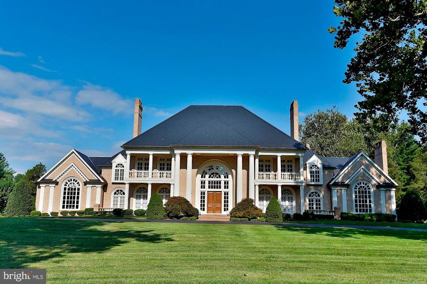 Ignore the year built date!  The original home was leveled except for a foundation wall.  This home was built in 1993!  One of the most incredible homes you will ever see and on a truly beautiful, usable, close-in,  4+ acre setting along with one of the most coveted addresses in Potomac!   The construction and finishes are of the highest, craftsman-level quality.  Before you even enter, you will notice the perfect masonry, rolled edging brick steps and tall, mahogany front doors.  Inside, but out of sight, is the steel beam construction and expert electrical wiring.   The dramatic two story entry foyer with a double sweeping staircase and a custom "skylight" will take your breath away.  The gorgeous interior finishes include marble flooring with granite inserts, premium grade Brazilian cherry flooring with wood inlay and brass detailing, the most magnificent millwork: dentil molding, wainscoting, fluted column accents.  Wait till you see the cherry wood paneled Library with a vaulted ceiling, double palladian windows and a handsome carved wood gas fireplace.  The vaulted ceiling was installed by a master craftsman with matching cherry panels.  Throughout the home, Wayne Maddox, the architect, repeated curved doorways and windows offering exceptional symmetry.  Mr. Maddox's thoughtful and practical design allows for extraordinary entertaining spaces as well as comfortable, casual living areas.  His use of a transverse hallway allows for easy access to every room and the elevator offers easy access for all ages and abilities.  The exterior includes a secure, gated entry, professional, manicured landscaping and hardscaping.  The rear stone terrace is perfect for summer entertaining poolside.  The all brick pool house with "his" and "her" baths is beautifully crafted as well and is a wonderful statement piece for the rear setting.   Enjoy acres of rolling lawn, along with a barn/stable with water and electricity.  This offering is unrivaled; this estate cannot be reproduced anywhere near this price.   Call for your private showing today!