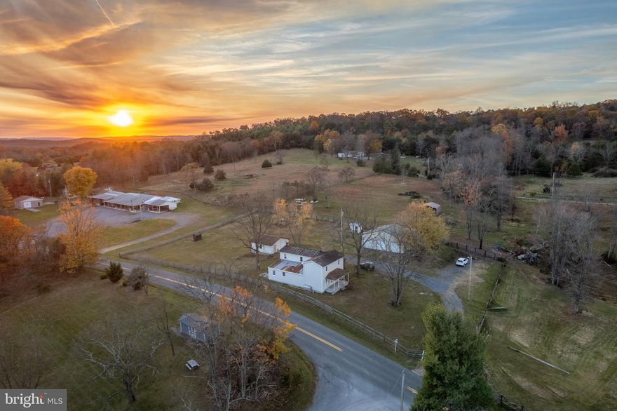 Amayzing Opportunity in Frederick County VA/ 15 Miles Outside of Winchester VA.  Farmhouse Style Home, 3 Bedrooms, 2 Full Baths! House Has Some Updates, But Will Need Additional,  Open Farmhouse Kitchen With Kitchen Island, Updated Cabinetry As Of A Few Years Ago (One Of The Cabinet Doors Is Damaged). Appliances Relatively New. Seperate Dining Room (Old Woodstove Hookup Is In This Room) Drywall Repair Needed. Full Bath On Main Level, Living room, Sitting Room With Working Woodstove.  Laundry Room Is On Main Level And Area Can Be Used For Storage Or Office Space. Upper Level Has 3 Full Bedrooms And 1 Full Bath.  Windows In Home Are Mostly Newer (Approx. 8-10 Years Old) Not Original Windows Except For 3. The New Windows Are In The Garage To Replace The 3.  The Metal Roof Has Been Maintained (100 Year Lifespan), Siding Was Replaced Approx 10 Years Ago.  Home Has So Much Potential.  Home Is Sits In A Rural Area, 16 Miles From WV Line, 16 Miles From Winchester. Close To Commuter Routes 37, 81, 66, 7 And 50.  Pasture Is 5 Acres, All Prepared For Horses.  Farm Animals Allowed, No Restrictions. The Property Boasts 2 Garages-Large 3 Bay Garage On Concrete Slab, And Regular 2 Car Garage On Slab. Both Have Own Electric Meters.  Large Garage Plumbed For Bathroom. No Covenants or Restrictions And No Hoa.  No Records On Well And Septic Received From Health Department Yet, However Waiting On Them. Well Head Sits Above Ground and Both Are Functional.  Heating Is Woodstove And Oil Furnace, Central A/C Is Cooling.
Home Is Selling As-Is!