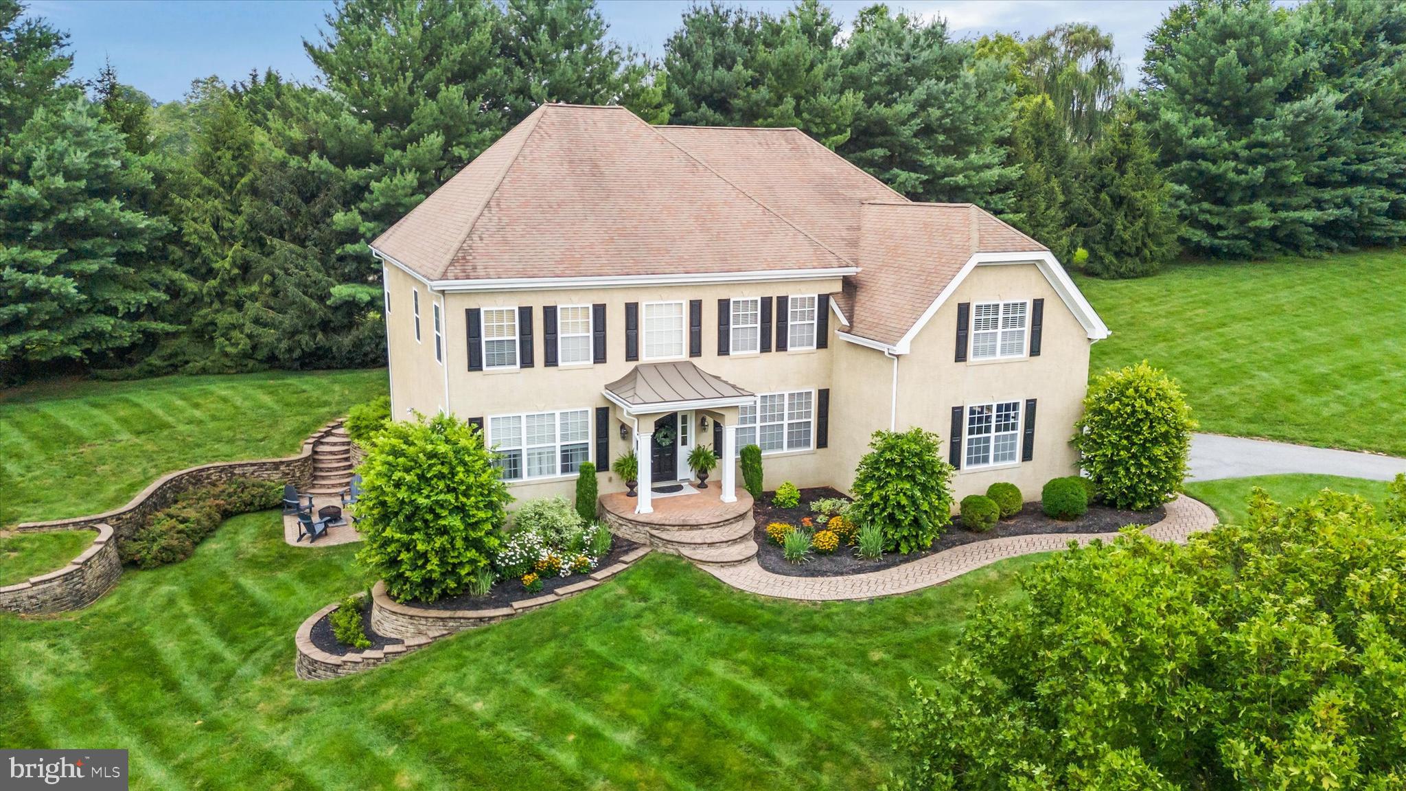 Welcome to 101 Lavender Hill Lane, a stunning Colonial nestled on 1.42 acres in the desirable Auburn Hills community of Landenberg, PA. This elegant 4/5 bedroom, 6-bathroom home offers over 6,200 square feet of thoughtfully designed living space, perfect for both everyday comfort and upscale entertaining. The main level features a grand two-story foyer with Brazilian cherry hardwood floors, formal living and dining rooms, and a private office/den with double French glass doors and a transom above, allowing natural light to flow through and creating an inviting, open atmosphere. The gourmet kitchen, updated in 2023, showcases quartzite counters, stainless appliances, and a large island—flowing seamlessly into a sunlit breakfast area and soaring two-story family room with a gas fireplace. The home boasts tasteful finishes throughout, including fresh paint, the complete removal of all carpeting for a sleek, updated feel, and impeccable design choices that reflect the current owner's refined taste. Every corner of this home has been meticulously maintained, showcasing the owner's commitment to cleanliness and quality. Upstairs, the luxurious primary suite includes a sitting area, dual walk-in closets, and a spa-like bath, while three additional bedrooms offer en-suite and Jack-and-Jill configurations. The fully finished walk-out basement, renovated in 2022 and refreshed in 2024, provides a complete guest or in-law suite with its own kitchen, full and half baths, living space, and patio access. Additional features include an invisible dog fence, new garage doors, and a three-car side-entry garage. Outside, enjoy a peaceful, private setting with paver patios, ample green space, and access to preserved land and community walking trails. Located in the Award-Winning Avon Grove School District, which features a new High School. Close to major commuter routes, this exceptional property blends timeless charm with modern upgrades in a picturesque, family-friendly neighborhood. Please note, this home is only available for sale due to the current owner’s career-driven relocation. This is truly a rare opportunity to own a meticulously maintained home in a prime location.