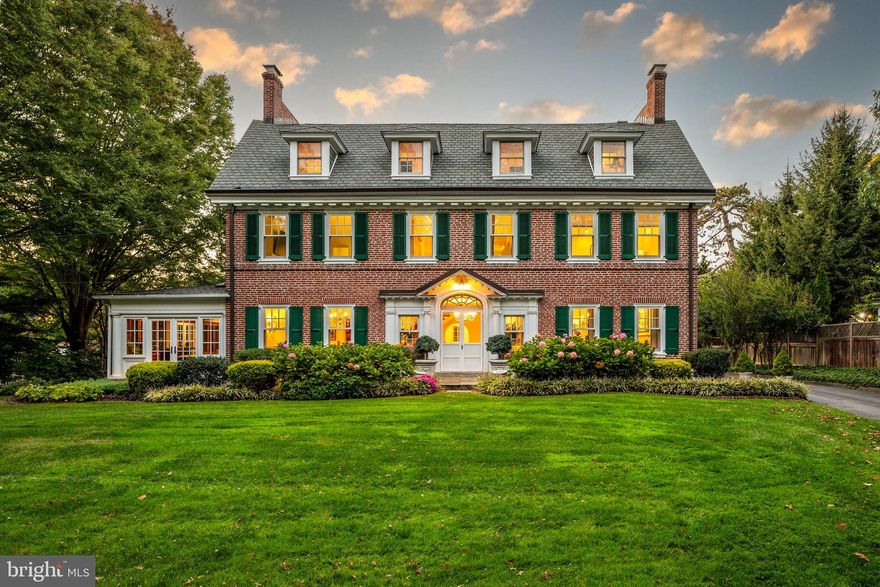 Historic Main Line treasure. Georgian Colonial estate host to storied Main Line history and revered families, including that of media magnet Henry Luce. Built in 1896, this timeless gem is perched on 1.1 flat acres in the heart of Haverford. Abutting a large neighborhood park and steps to the prestigious Haverford School, this home was also home to two of the school’s headmasters. The lot boasts a sprawling front lawn, flagstone terraces, gardens, a small pond with trickling waterfall, a lovely driveway circle, a backyard suitable for play, and a ring of evergreens for privacy. A detached carriage house includes 5 garage bays and a renovated 1500+sf, 2+ bedroom apartment that is properly zoned for renting, should one desire. The impressive grounds set the stage for a spectacular interior. Step inside the grand foyer to soaring ceiling heights, gorgeous hardwoods, classic archways, incredible millwork, oversized windows, and the exquisite detail and workmanship of a bygone era. Equally grand and gracious the home is warm and welcoming with wonderful flow and light. A grand scale Living Room centers around a wood burning fireplace flanked by arched french doors to a three-season enclosed Conservatory finished with fine wood detail. A library off the living room is warmed by a charming corner brick fireplace and bookshelves to the sky. The formal Dining Room with fireplace will comfortably seat the extended family. Large architectural openings through the formal spaces pass glorious light through the home. Step into an expansive kitchen with warm cherry cabinets, large center island, breakfast table, all of which open to a cozy family room.  A classic back entrance leads to a sizable mudroom/laundry space waiting to be outfitted with custom cubbies.  The grand staircase travels all three stories bringing abundant light throughout the three finished floors. The Primary Suite is highlighted by oversized windows and offers a two room bath with separate shower, jetted tub, bidet, ample closets and a dressing room which overlooks the rear terrace and gardens. Three large additional bedrooms, one with an ensuite bath and two which share a large hall baths share the primary second floor space. The back of the house, formerly staff rooms, are well-suited for additional gym, office or guest space and are easy to access through a hallway or back staircase. The tall ceilings, hardwood floors, and open stairway continue on the third level, which offers three large additional bedrooms with a shared hall bath. Important upgrades make this home Smart and energy efficient. New windows throughout and top of the line heating system make for very reasonable utility bills. Recessed lighting installed in several rooms are on Lutron Caseta smart switches. Located conveniently in the center of Haverford on a quaint, neighborly street. Walk 100 paces from the front driveway to “Friendship Pass”, a flagstone pathway directly to the Haverford College Nature trail.  A private gate off the backyard leads to Preston Park, which has a new tennis and pickle ball court in addition to soccer fields, basketball courts and three playgrounds. Walkable to Haverford town center and train station, the Bryn Mawr Acme and even The beloved Bakery House. A commuters dream, close to all major roadway, Septa R5 with rails to Philadelphia and beyond. New roof (2020 and 2023), new high efficiency boiler (2019).