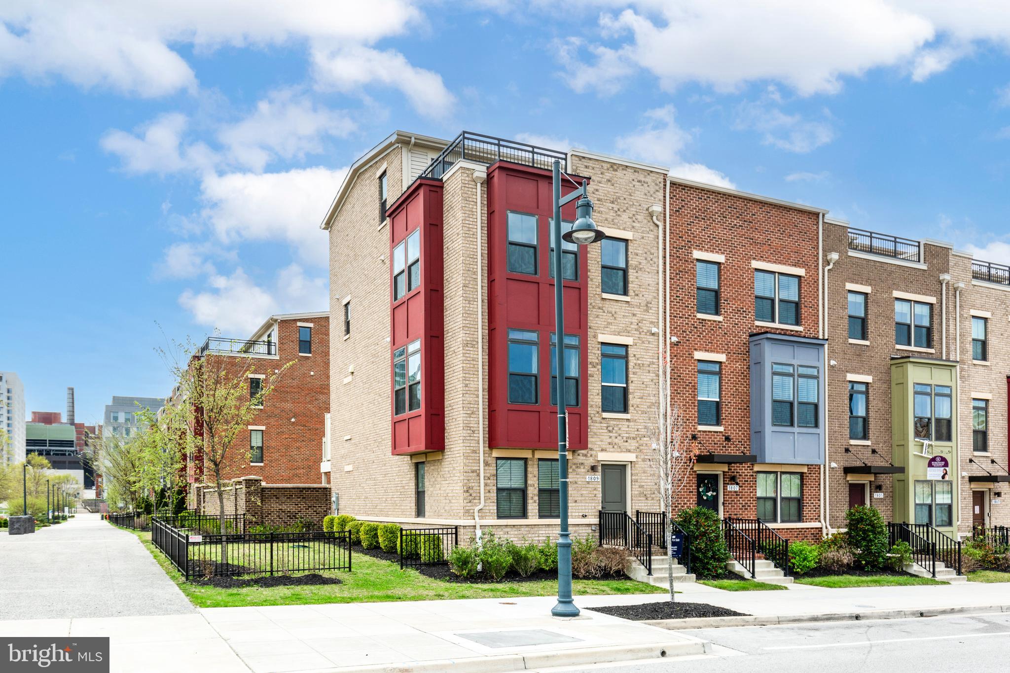 Welcome to urban living at its finest in this like-new, end-of-row townhome nestled in the heart of Baltimore’s vibrant Eager Park community! This beautifully upgraded home features 4 bedrooms, 3 full bathrooms, 2 half bathrooms, and 2,268 SqFt of modern living space. With only one owner since it was built five years ago, the home is meticulously maintained and showcases state-of-the-art finishes, luxury vinyl plank flooring throughout, and a light-filled open-concept design. The entry level includes a flexible bonus room—perfect as an office, den, 5th bedroom or second living area—along with a half bath. The main level offers a spacious chef’s kitchen complete with granite countertops, stainless steel appliances, large island, pantry, living room, dining area, and another half bath, all flowing seamlessly to a private deck—ideal for entertaining. Enjoy the convenience of two primary ensuites: one on the third level with a dual sink vanity, oversized walk-in shower with dual shower heads, and walk-in closet; and a second on the fourth level with sliding doors leading to a private rooftop terrace offering stunning city views—this space can also function as a bedroom, lounge, recreation room or home office. Additional features include a 2-car garage, parking pad, EV charger, dual-zoned HVAC, tankless water heater, whole-house humidifier, in-home fire suppression system, and a spacious side yard perfect for outdoor activities. Residents of Eager Park enjoy access to a community garden, park, outdoor fitness equipment, playground, live concerts, movie nights, seasonal festivals, and events year-round. Ideally located just three blocks from Johns Hopkins Hospital and minutes to dining, shopping, and Baltimore’s best attractions including Camden Yards, M&T Bank Stadium, the Hippodrome, the Inner Harbor, Federal Hill, Locust Point, Fells Point, Canton, BWI Airport and all that Baltimore has to offer. Eligible buyers may qualify for the Live Near Your Work grant! Don’t miss the opportunity to call this exceptional home your own!