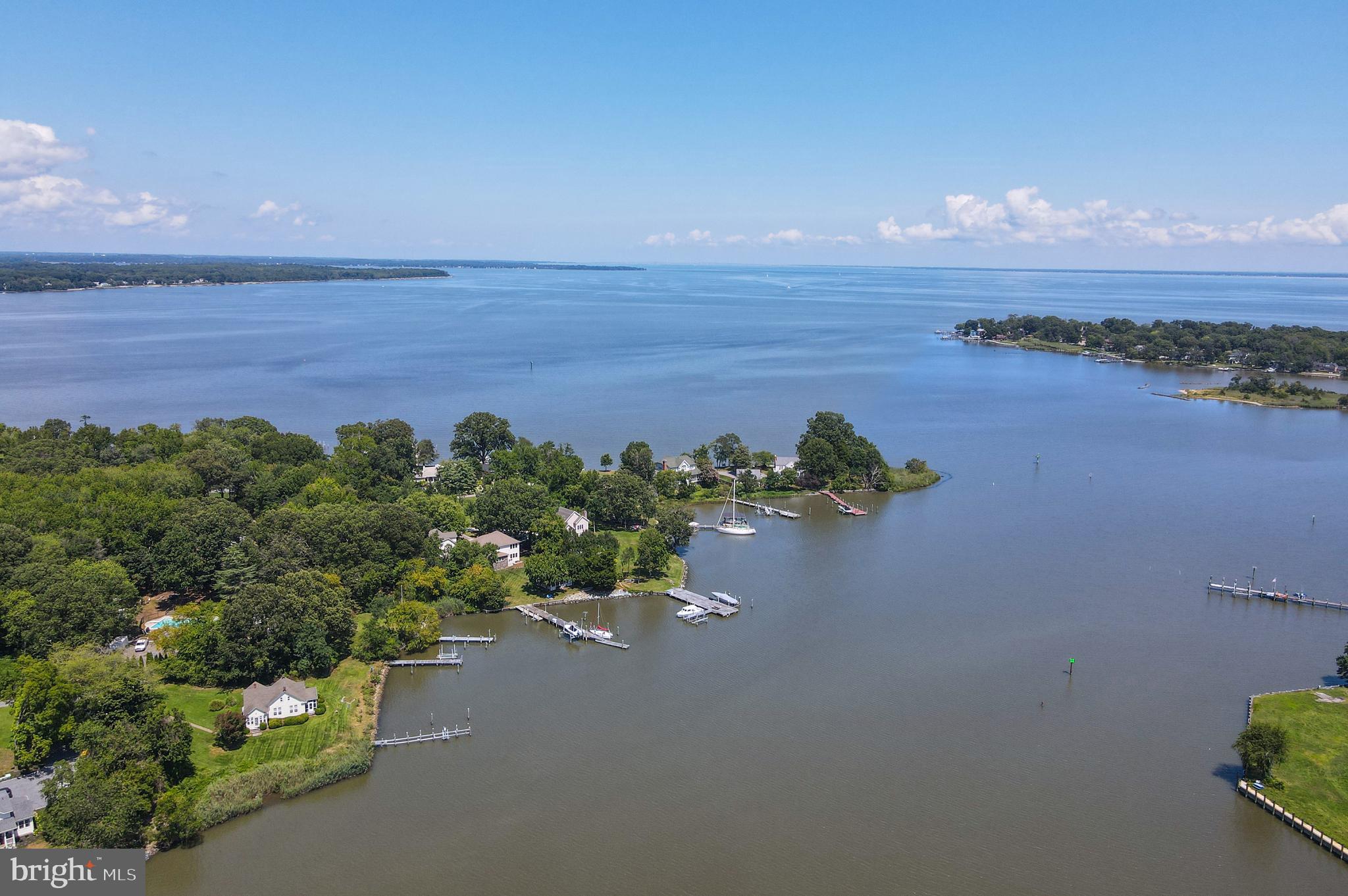 Stunning waterfront retreat nestled along the serene shores of the Chesapeake Bay, located in the charming community of Shady Side, Maryland. Perfectly situated on Parish Creek, this spacious, move-in ready home offers a unique combination of comfort, privacy, and coastal living. The open-concept floor plan on the main level features a gourmet kitchen with sleek quartz countertops and island, a cozy breakfast area, and a generously sized great room. A dining room/office and sitting room provide versatile spaces for both relaxation and work, complemented by a full bath for added convenience.
Upstairs, the tranquil waterfront primary bedroom offers a peaceful sanctuary with an ensuite bathroom and two walk-in closets. Three additional bedrooms, one full bathroom, and laundry room complete the upper level.
Just steps from the water, a 20' x 20' screened cabana creates an ideal space for dining, reading, or simply enjoying the beautiful views. The detached three-car garage adds exceptional value with a fully-equipped one-bedroom, one-bath apartment above, offering the perfect space for guests or additional living needs.
For boating enthusiasts, the private 100-foot pier is a true highlight, featuring a 30-foot floating dock with a 12,500lb lift, two jet-ski lifts, electrical and plumbing connections, and a water depth of 4' MLW, ensuring ample space for all your water activities.
Additional amenities include a full irrigation system, horseshoe pits for outdoor entertainment, smart home switches, and a connection to public sewer.
Ideally located just 30 minutes from Annapolis and less than an hour from Washington, D.C., Shady Side offers a peaceful waterfront lifestyle with marinas, quiet beaches, and a strong sense of community. Whether you’re seeking a weekend getaway or a permanent residence, this is your chance to own a piece of Chesapeake Bay paradise.