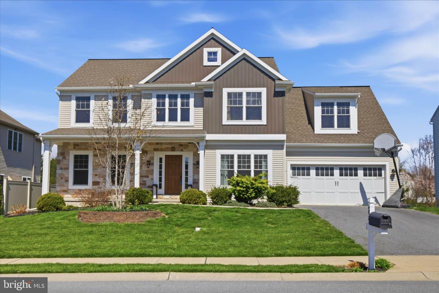 Step into refined comfort in this beautifully crafted 4-bedroom, 3.5-bath home by Landmark Homes, ideally situated in the sought-after Penn’s Crossing neighborhood. Thoughtfully designed with timeless appeal, this residence offers an open yet well-defined floor plan, blending everyday functionality with effortless entertaining. The main level showcases a private home office, a formal dining room adorned with elegant wainscoting, and a spacious family room featuring a cozy gas fireplace. Craftsman-style trim throughout adds warmth and character, while the chef’s kitchen serves as the heart of the home—complete with abundant cabinetry, a large center island, generous counter space, and seamless flow into the main living areas. A well-designed mudroom with built-in lockers provides practical organization for daily life. Upstairs, the primary suite offers a peaceful retreat with a private bath. A second bedroom includes its own en-suite, while the remaining bedrooms are bright, spacious, and versatile. A convenient second-floor laundry room enhances everyday living, and a flexible loft area is perfect for a home office, study nook, or additional lounge space. The lower-level features 9-foot ceilings and Superior Walls, offering excellent potential for future finishing. An outside entrance and ample storage space make it easy to accommodate seasonal items and larger belongings. Enjoy outdoor living on the spacious patio, perfect for relaxing or entertaining guests. Additional highlights include a main-level powder room, attached garage, and a layout designed to meet the needs of modern living. With quality craftsmanship, thoughtful design, and a prime location in Penn’s Crossing, this home is an exceptional opportunity. Schedule your private tour today to experience all it has to offer!