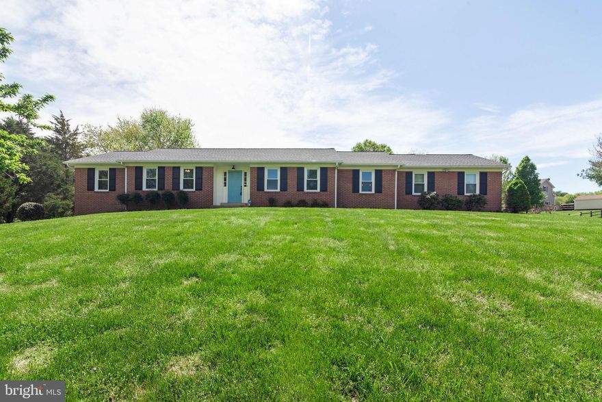 Spactucular Renovation w/High End Upgrades. This 4BR/3BA rambler is situated on 1.27 beautifully landscaped acres in well established Lawnvale Estates. Home boasts a fully finished walk-out basement, master suite on main level & 4-car garage. Original owner! Updates include: new dimensional roof, siding, hvac/heat pump, hot water heater, low-e double-hung windows, flooring, insulated garage doors, Energy Star appliances & more. Interior is open & bright w/new hardwood floors, fresh paint & crown molding. Yard is private & beautifully maintained w/2 patios, fenced garden plot & plenty of space to entertain & play. Fully renovated kitchen is light & open w/custom built shaker-style cabinetry, sapele (African mahogany) breakfast bar, silestone quartz countertop, stainless steel appliances, large chef sink & high-end fixtures. Living room has a wood burning fireplace & opens to patio. Formal dining room w/chair railing & morning room off kitchen. Main level master bedroom has fully renovated private bath & all bedrooms w/new carpet, fresh paint & ceiling fans. Fully finished basement is a walk-out w/full bathroom, laundry room, wood burning fireplace & space for more rooms. Great opportunity to turn into an in-law suite. Basement patio is serene & second patio off living room is adjacent to fenced-in garden plot. 4 car garage is oversized & is side loading. Located right off of Rte 234 near Haymarket & minutes from Rte 15, 29 & I66. Nearby shopping, dining & amenities. Open House on Sunday April 28 from 1-4pm.