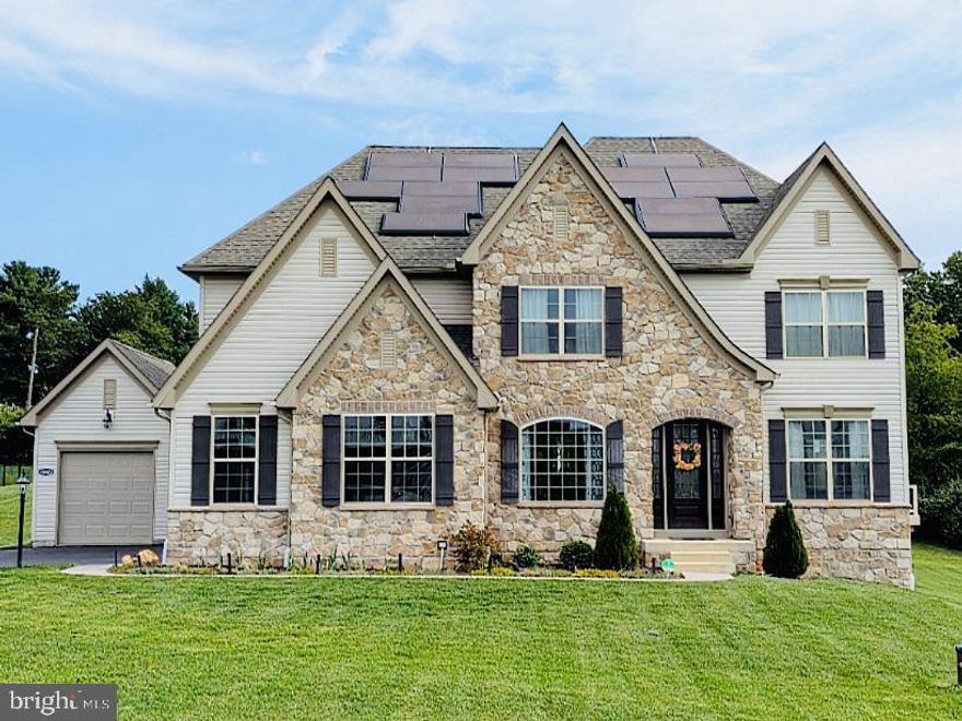 Taking back-up offers. Showings by appointment only. 
Keystone is currently building on one acre lots in Howard County STARTING at $1.5m 
***To build a Keystone Devonshire Model that has all of these  upgrades**Plus* solar panels with POWER WALLS (WHOLE HOUSE GENERATOR) will cost at least*$1.8m!*

Built  in 2021 (with 17 years left on the transferrable BUILDER WARRANTY),  this stunning residence offers a perfect blend of luxury, space, and modern living.  Welcome to the Enclave at Glenelg, a premier Keystone Custom Homes community nestled in picturesque  Mount Airy, Howard County.
Featuring 5 spacious bedrooms (including a main-level en-suite and  upstairs PRINCESS SUITE) within 6,000+ square feet of perfectly designed space, offering both comfort and functionality; this residence checks all the boxes!
Impressive 2-story GREAT ROOM.  The open floorplan is flooded with natural light and  beautiful views from every window.  Formal dining room for throwing dinner parties or holiday meals. BUMP-OUTS are an upgrade to the build offering more square footage and windows. 
The heart of this property is the CHEF’S KITCHEN, with lots of upgrades, high-end appliances and oversized QUARTZ 5ft x10.5 ft  island that make cooking and entertaining a culinary dream!  High tech, top of the line appliances, including Thermador Induction Stovetop (learn more here) https://youtu.be/oAEOymzWMaw  DOUBLE WALL OVENS, Quartz countertops, matte black faucets and hardware, oversized stainless farm house sink, custom back splash,  and an abundance of soft-close cabinets. BUTLER’S PANTRY w/ sink and  wine fridge!
2nd staircase off the garage entry mudroom for private entry and convenience. MAIN LEVEL EN SUITE (currently being used as an office) with walk-in closet is ideal for main level living, guest quarters or in-law accommodations with potential for private access from the third garage bay. Stunning owner's suite with INSULATED WALLS for sound dampening! Featuring a spa-like bathroom w VENETIAN shower, separate SOAKING TUB, double vanity, heated back-lit mirrors, closeted toilet, high-end finishes, and 2 WALK-IN closets. 
2nd floor is FULLY INSULATED to provide noise reduction. Interior doors are SOLID CORE, offering even more insulation and sound proofing. 
Three additional large bedrooms: 2&3 share a JACK & JILL bathroom with double vanity, bedroom 4, the PRINCESS SUITE  is an additional en suite to complete the 3rd level. Each bedroom has a large WALK-IN CLOSET. UPSTAIRS LAUNDRY room for added convenience. 
MOISTURE BARRIER padding on all carpeted areas. 
The finished basement is the ultimate space for family fun, featuring a FULL KITCHENETTE ideal for game nights and  fun. The basement also has a rough-in for a FULL BATH, offering future expansion opportunities.

Step outside to the spacious DECK **16' x 38' ( 600 sqft) with 2 sets of stairs to front and back of house**, a perfect spot for outdoor entertaining or simply enjoying the serene surroundings. Whether you're hosting summer barbecues or enjoying a quiet evening under the stars, this outdoor space enhances the livability of the home.

The garage offers EXTRA-HEIGHT doors to accommodate larger vehicles. The third garage bay provides flexibility for additional parking or could be converted into a private entrance for the main-level  en suite.  Complete with a 40-A Tesla wall car charger.

15.6 kW solar panels. Powerwalls provide 27 kWh total energy capacity for solar energy storage and emergency backup power.  You'll enjoy savings with low energy bills while living green.
ETHERNET PORTS throughout. 
Active radon system. Sprinkler system. 
Located in  highly desirable Howard County,  this property combines the best of modern luxury, family-friendly design  for both comfort and sophistication. Don't miss your chance to own this exquisite home in a vibrant community that offers privacy, convenience, and a wonderful lifestyle.