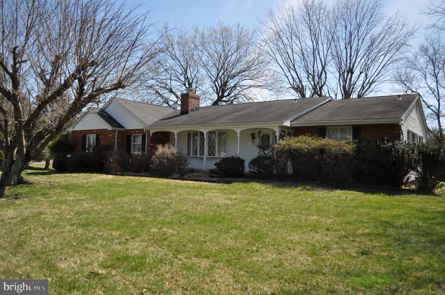 Custom built for owners who loved to entertain, this classic rancher is ready for new owners to love it and update it. One-level living includes the living and dining rooms, kitchen, bedrooms, 2 full baths, laundry, and sunny solarium, plus the oversized two-car garage. The unfinished basement has space for storage, hobbies, and a workshop.  With more than 2 acres, the property has plenty of space for outdoor living, gardening, and play areas. The house and 2.9-acre property convey 'as is'. The pond appears to be the headwaters of a stream running through adjacent areas but the seller does not have information about it.  The fuel oil tank is buried behind the house.