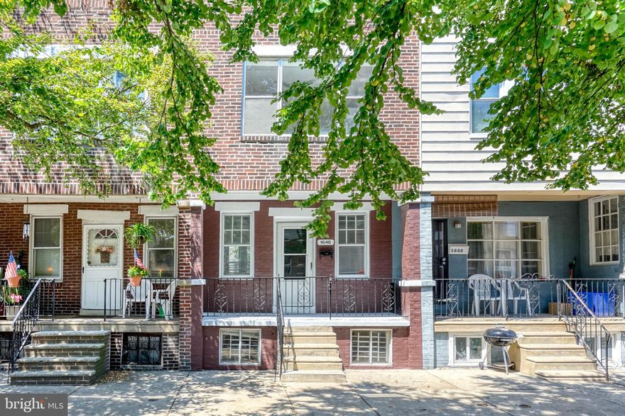 Tucked away on a low-traffic block in Philly's Grays Ferry neighborhood, you'll find 1646 S Etting St. This updated 2-story home offers 2 beds, 1 bath, a rear patio, and tons of extra space in the basement. The exterior of the home greets you with a classic brick facade and a welcoming front porch. Inside, gleaming original hardwood floors and exposed ceiling beams frame the open-concept main level. Tall bright windows at the front and rear fill the separate living and dining areas with natural light. The kitchen is fitted with inset cabinetry and newer appliances. Out back, the well-kept rear patio is ideal for summer barbecues and perfecting your green thumb. On the home's second level, the original hardwood floors continue throughout. There's a large bedroom with an expansive window at the front and another bright bedroom at the rear. A full bathroom sits at the center. Completing the home is a dry, clean basement where you'll find the washer, dryer, gas furnace, gas water heater, and tons of extra storage space. In addition to everything inside, 1646 S Etting St's convenient location is a short walk from local eateries and markets. Vare Rec center is just around the corner, and nearby Lanier Park has a playground and dog run. There's also easy access to public transit, I-76, and University City. Schedule your in-person or virtual tour today!