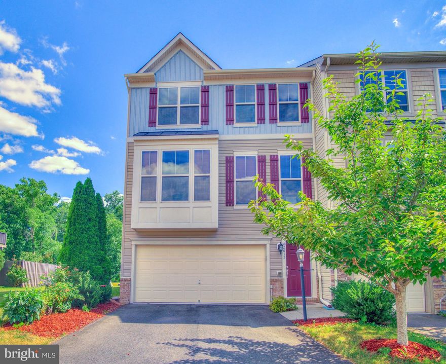 This beautiful end-unit townhome is available in the highly desirable Alexanders Chase community in Broadlands. The spacious BRADFORD Model offers over 2900 sq ft of finished living space, with 4 bedrooms, each featuring walk-in closets, and 3.5 baths. The attached garage adds convenience, and the property backs onto serene woods and a lake view, providing a tranquil environment. New carpet in the lower and upper levels, and freshly painted. 
The heart of the home is the stunning kitchen, featuring a large open space with a breakfast room and dining area. The kitchen also boasts plenty of granite counter space, beautiful cabinetry, gleaming hardwood flooring, and stainless steel appliances. Upstairs, you'll find the spacious primary suite with a spa-like bathroom, two additional bedrooms, and another full bath. Laundry facilities are conveniently located on this level. The lower level offers versatility with a full bath, an extra bedroom, and a rec room with carpeting and a glass door leading to the backyard. The community offers ample parking, common areas, and a playground.
You won't want to miss out on this fantastic opportunity in Broadlands. Conveniently located near shopping, dining, golf courses, and entertainment, including the Brambleton Town Center and Beaverdam Reservoir. It's just minutes from the Dulles Greenway, Route 50, Route 28, and Route 7, and minutes to the Silver Line Metro station.