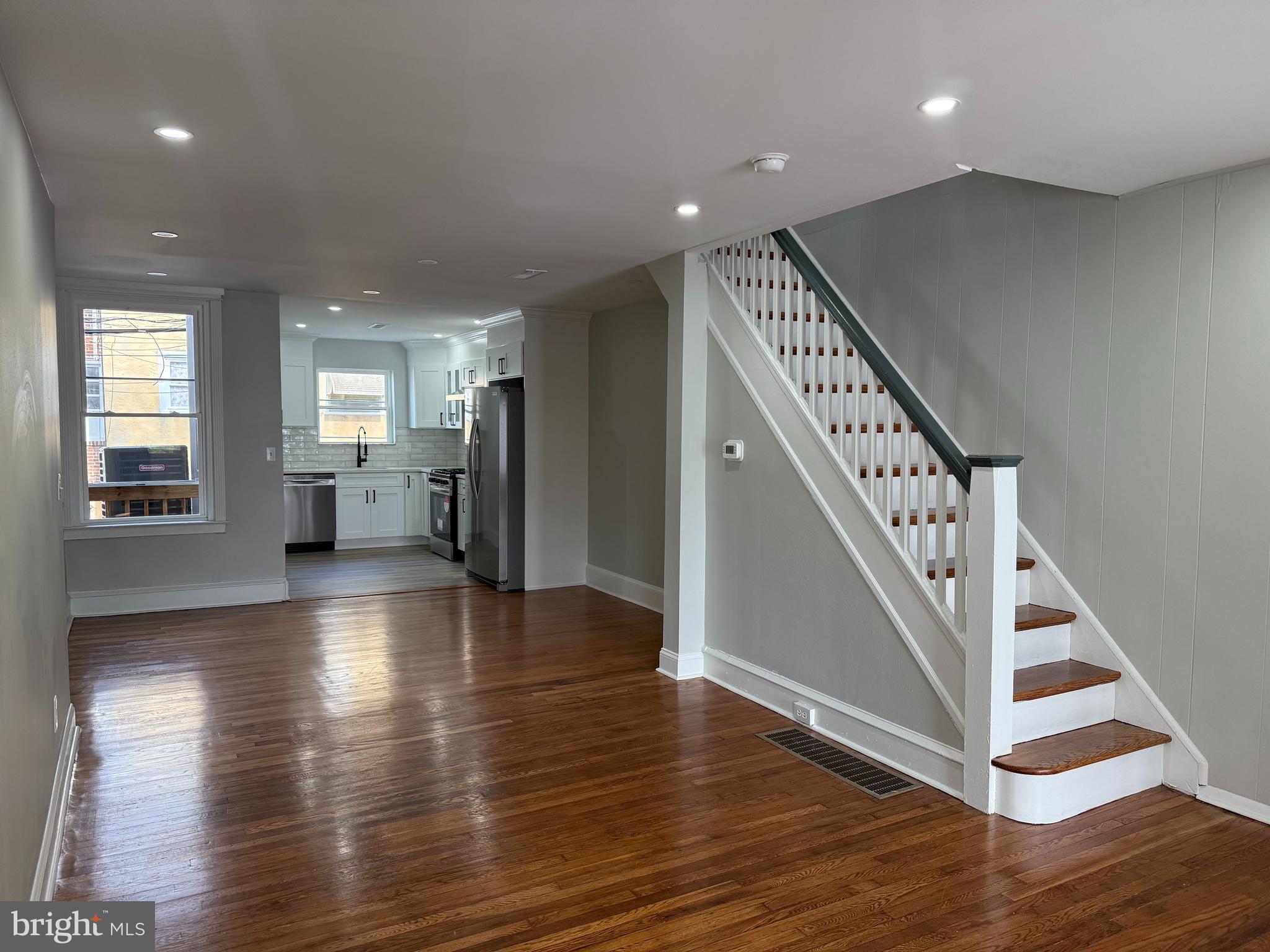 Beautiful, completely renovated, house that features a 4th bedroom and full bathroom in the basement! Enter through the enclosed porch to a Large Living Room with beautiful hardwood floors. All New Luxury Kitchen with Stainless Steel appliances and Granite countertops and tile backsplash with white designer kitchen cabinets. There is built-in lighting throughout this house! 2nd Floor has three bedrooms and a large full bathroom with tub. The finished basement has a bedroom and full bathroom with access to parking in rear. Central Air and Laundry Room with Washer/Dryer.