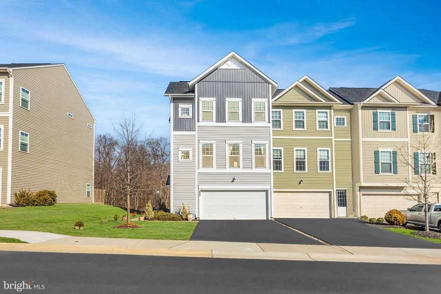 Nestled in the desirable Snowden Bridge community, this amazing townhome has a private backyard with tree views! Built in 2019, this well-maintained end-unit townhouse offers nearly 2,745 sq.ft. and 3 bedrooms + 3 full and 1 half bathrooms. 

As you enter, you are greeted by a warm and welcoming ambiance, enhanced by plush carpeting and elegant recessed lighting throughout. The heart of the home features a thoughtfully designed combination kitchen and living area, perfect for both entertaining and everyday living. The gourmet kitchen is a chef's dream, equipped with stainless steel appliances, a gas oven/range, and a spacious island that invites culinary creativity. The adjoining family room, bathed in natural light, creates a seamless flow for gatherings and relaxation. 

Retreat to the luxurious primary suite, complete with two generous walk-in closets and a spa-like bathroom featuring a soaking tub and a walk-in shower; your personal oasis for unwinding after a long day.

Step outside to discover a beautifully landscaped lot that backs to serene trees, providing a tranquil backdrop for outdoor enjoyment. The premium lot features a rear yard, side yard, and a front yard, perfect for gardening or simply soaking in the peaceful surroundings. The community amenities elevate your lifestyle, offering access to a swimming pool, tennis courts, basketball courts, and scenic walking paths, all designed for leisure and recreation. 
This property is not just a home; it's a lifestyle. Don't miss it!