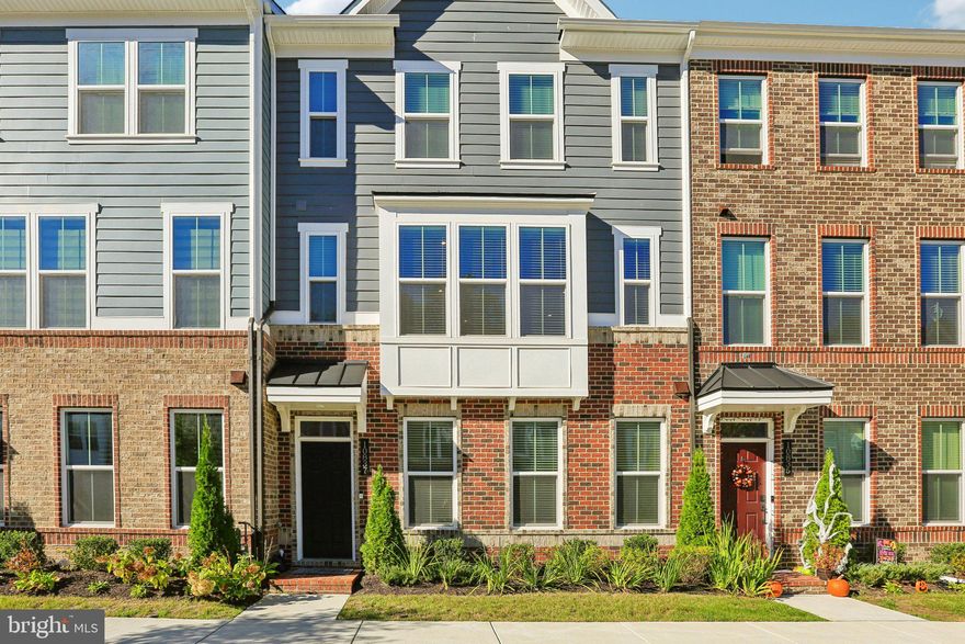 SHOWINGS BEGIN 1/2/26! The BEST of Greenleigh at Crossroads - all the advantages of a new build without the wait!  GET READY to be AMAZED by this ELEGANT CONTEMPORARY townhome with nearly all the upgrades a builder could offer. The home is graced throughout with high ceilings, wood steps, recessed lighting, truly luxurious vinyl plank, plush carpet and real ceramic tile. HOME IS LIKE NEW!! FALL IN LOVE with the SHOW-STOPPING KITCHEN, truly a chef's delight with 6-burner natural-gas stove, custom tile backsplash, SS appliances, HUGE GRANITE countertop  and fresh-white generously tall cabinetry offering plenty of storage. OPEN CONCEPT is the name of the game - kitchen, living room and dining areas are totally open and offer a PERFECT setting FOR ENTERTAINING. Off the kitchen and dining area - through a DOUBLE SET OF SLIDING GLASS DOORS- you will find this home's most precious upgrade: a BALCONY LIKE NO OTHER with FLOOR TO CEILING STONE FIREPLACE creating a wall of sophistication and privacy. Enjoy this very special space, complete with ceiling fan/light, t.v. wiring  and customizable Fireplace FLAME COLORS! You'll relish your time here sipping coffee, wine and taking in a peaceful snowfall in front of your fire! Moreover, as the day melts into evening, gaze out at the SPECTACULAR SUNSET over a distant view of the park tree-line. As you head back inside, you'll love the extra light from the triple-window front in the living room. Painted in wonderfully neutral palette, this entire 2nd-story/main level will accommodate any color scheme you bring. Just before heading to the upper level, find the conveniently located powder room, making a bathroom on every level. Ascend to the uppermost level of the home, where you will find 3 bedrooms, laundry & 2 full bathrooms. The owner's suite, which graces the rear half of the floor, is adorned with beautiful & very clean carpet, and provides all of the peace and privacy you could desire. The attached primary bathroom boasts custom upgrades: a WALK-IN SHOWER with FRAMELESS GLASS DOORS, DUAL SHOWER HEADS, BUILT-IN SHELVING and a ROMAN BENCH. Dual-vanities & ceramic tile flooring complete this stunning bathroom. The 2 front bedrooms are approximately the same size with ample closet space in each and plush carpeting, recessed lighting; the slightly-larger of these rooms is beautifully appointed with wainscoting & a rich shade of green. A full bathroom with dual sinks and tub-shower makes sharing "getting ready" space a breeze for these 2 bedrooms. The laundry closet on this level  is the cherry on the top of perfection and affords a lifestyle advantage for the busy person who needs to execute chores efficiently! Last ... but not least, is the 1st level, which affords entry from the garage & the front door. Entry from the garage greets with a built-in Welcome Station to promote household organization. Adding to the convenience of this level is a full bathroom w/ walk-in shower, ceramic tile and recessed lighting. A carpeted FLEX ROOM is on this level offering ideal space for home-office, play room, family/t.v. room, game room, craft room & even exercise room. Behold the 2-CAR ATTACHED GARAGE!! With a SOARING CEILING of its own, it offers abundant storage, EV charging, & all of your utilities: tankless water heater, sump pump, electric panel & HVAC. There is space to create another level/story within the garage, if additional storage is desired. AMPLE PARKING with 4 private spaces on the property, a 2-car garage and driveway that accommodates 2 more. Greenleigh at Crossroads is a clean & quiet community close to multiple parks & walking trails, offering so many amenities: a large kiddie pool, a massive in-ground pool conducive to lap swimming, a community building, gym, conference center w/ kitchen, yoga room! Dining, shopping & professional services are located in Greenleigh. Convenient to local & major travel routes, this home offers everything you want and need. Schedule tours now for January!