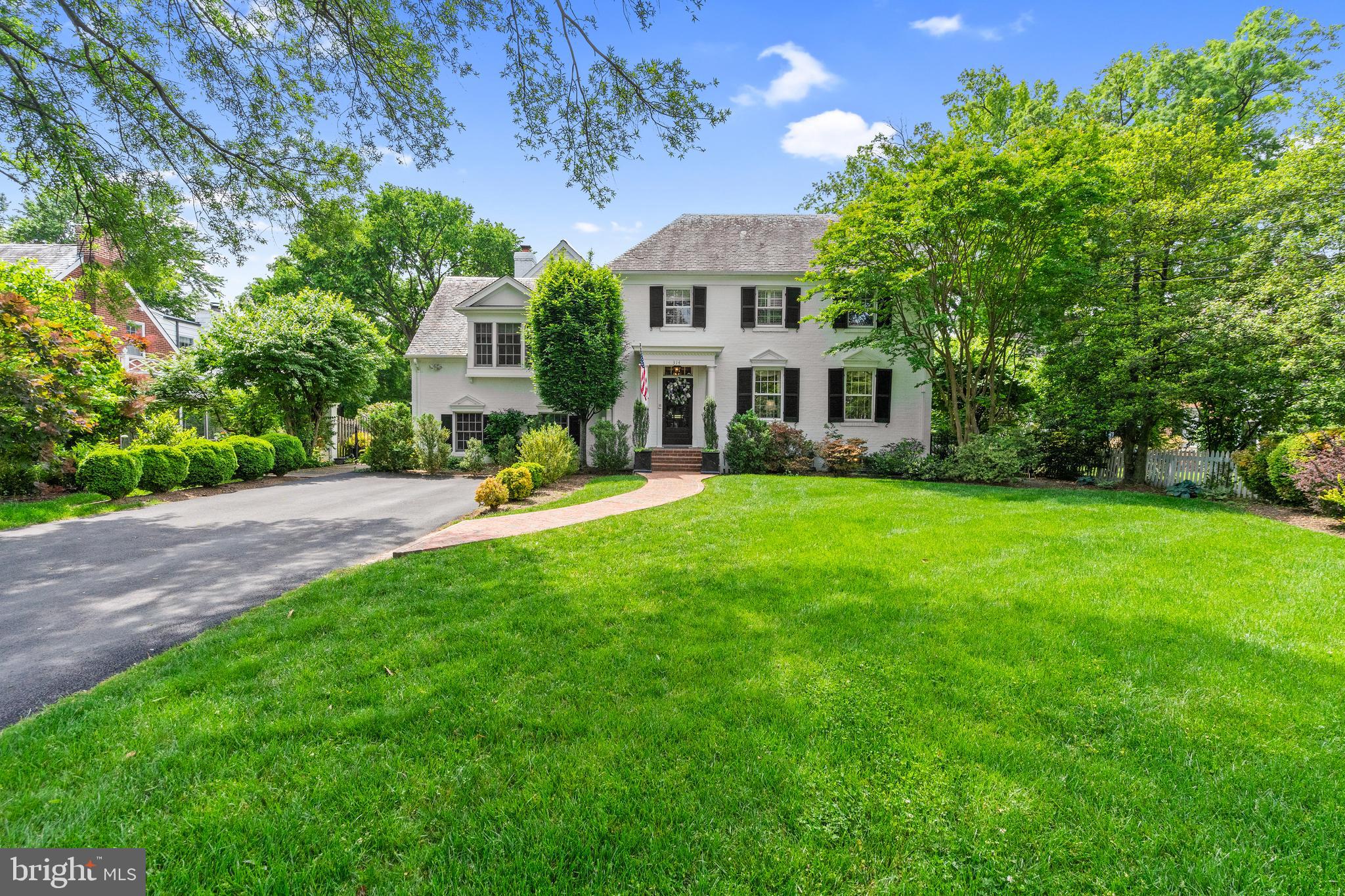 Located on one of Alexandria's most sought-after tree lined streets, this classic brick colonial is perfect for gracious entertaining and comfortable family living. Among the many special features of this home are vaulted ceilings, detailed moldings, hardwood floors, recessed lighting, tray ceilings, balcony, Paladian windows, French doors and more.
Formal living room off the marble foyer features a gas fireplace. A wet bar and powder room connect the living room and dining room. The formal dining room with French doors opens to a brick patio overlooking the private fenced backyard. Fantastic light filled kitchen with large eat-in space, double ovens, Sub-Zero refrigerator, Jenn-Air gas grill, built-in microwave, double sink, tray ceiling, recessed lighting and wood floors, are open to the family room with wood burning fireplace. Spacious screened porch and classic library
with custom cherry built-in bookshelves complete this level. Five bedrooms, and three full baths are offered on the upper levels. Powder room on the main and lower level.
Plenty of off-street parking or easy on street. Renovations by Gill and Yost, now retired.
Beautiful mature trees and plantings highlight this stunning home.