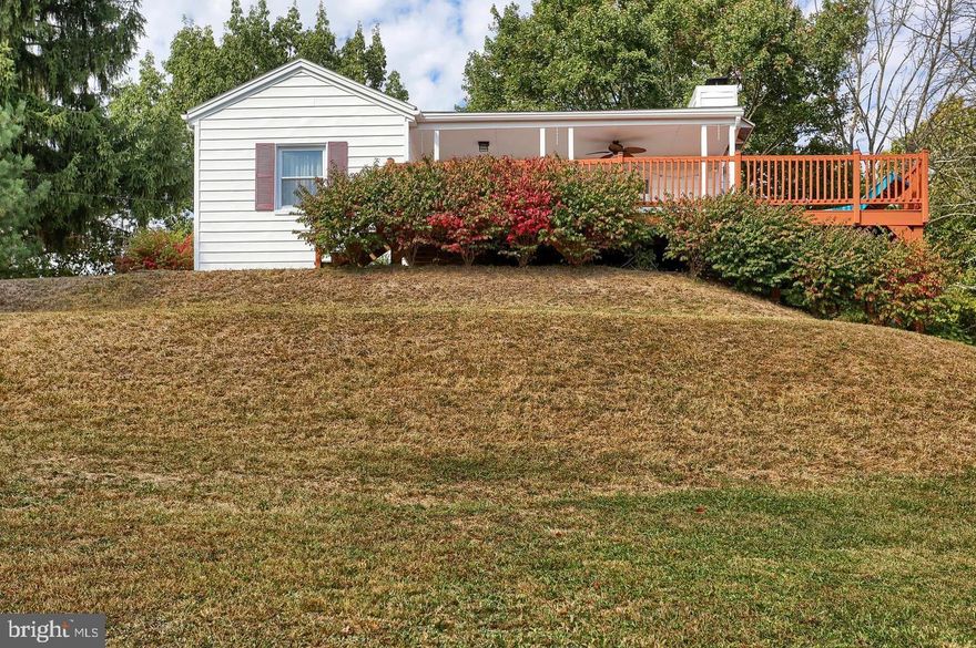 Welcome to this beautiful home in Carlisle with panoramic views and a feeling of being immersed with nature! This 2 bedroom ranch style home has a large deck to entertain or unwind after a long day.  Once you enter, you will see a nice size living room with a fireplace that has a cozy wood burning stove. Just past that is a beautifully remodeled kitchen ready for family dinners. This home offers a remodeled bathroom and a full basement with laundry hookups.  Outside the home, you'll find a detached two- car garage and a car port, offering plenty of parking, along with a nice-sized shed. The expansive yard features a garden, fruit trees where deer and other wildlife like to pass through, and a large cabin with storage inside and out  You won't want to miss out on this beautiful property!