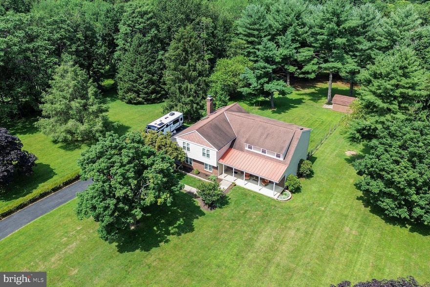 Beautiful sunsets; lush, green grass; expansive outdoor space—a setting of utter tranquility! Perfectly situated on just over 3 acres of land, this home offers your family the outdoor living you’ve been seeking. Peacefully enjoy your morning coffee on the front porch, comfortably grill dinner under the pergola, and kick back and relax as you watch the scenic sunset from the screened-in back porch. As a bonus, a generous portion of the land is fully fenced, allowing for children or the family pet to safely play and explore. But wait, there’s more! Indoors, you will be pleased to find that the main level has everything necessary for hosting, whether it’s for formal entertaining or casual get-togethers. The pickiest foodie expert will love the modern kitchen with direct access to a pergola deck for that added grilling convenience. The upper level offers a spacious primary bedroom with a luxury en suite, walk-in closet, an additional closet, a sitting area, PLUS the perfect office space with a loft-view down into the family room. Two additional bedrooms, a hall bath, and laundry complete this level. The lower level is very versatile, offering a recreation area with a bar and a brick platform with a gas hookup for your gas fireplace or wood burning stove. Additionally, there is plenty of room for your home gym. All bathrooms are fully updated; wood floors run throughout the main and upper levels; the gas furnace and a/c were replaced in 2020; and a UV light and 5 micron water treatment filter system was added in 2021. To top it all, this beautiful home is conveniently located by shopping, a top-rated library, parks, and an array of restaurants! You won’t want to miss seeing this home and all it has to offer, so hurry and schedule your visit today!