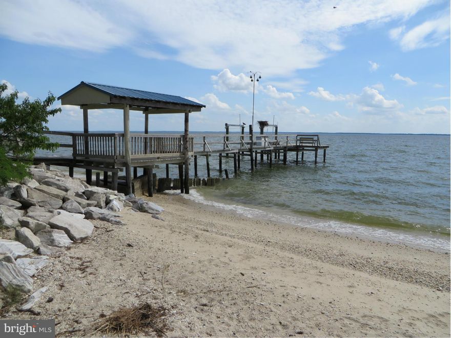 Sandy beach, pier, boat lift, and incredible sunsets over the Potomac River! Spacious great room w/open living, dining, & KT; big windows to enjoy the view, lots of cabinets & counter space. Sunroom addition the perfect place to watch the sunset! Hardwood & ceramic tile flooring. Bsmnt w/rec rm, BR, full bath, large storage room. Deck, LL covered patio, big shed, Leon schools, 6-8' water at lift!