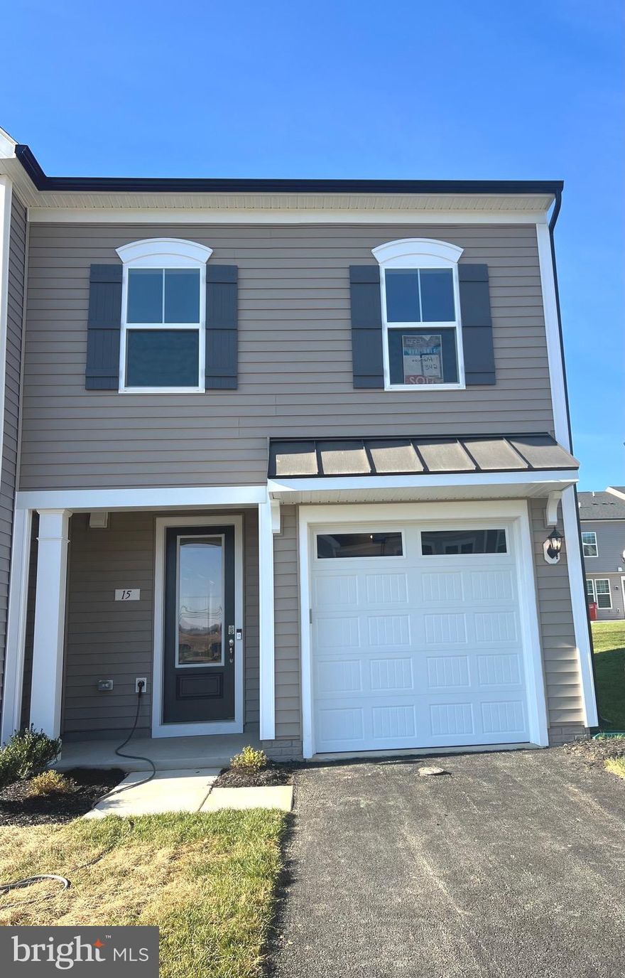 Welcome to King's Crossing! The newest neighborhood in Charles Town, WV. 2 Level, Garage Townhome with a Finished, Walkout Lower Level! This spacious townhome offers an open 1st floor plan with popular luxury vinyl plank adorning the entire 1st floor as well as an LED lighting package. The well-appointed kitchen features an island, upgraded cabinets with Quartz countertops, stainless steel appliances, pendant lighting, and much more. The primary suite features a walk-in closet and ensuite with a 5 ft shower and dual sink vanity. Two secondary bedrooms a full bathroom and a conveniently located laundry area complete the second floor of this townhome.