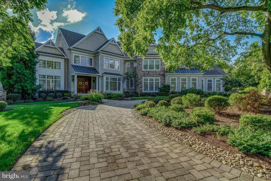 Arts & Crafts Style Elegance defines this magnificent Estate.  Marble inlay in Foyer, 22ft ceilings in  Living Room.  4 Gas Fireplaces.  Amazing Gourmet Kitchen.  Gorgeous Master Retreat,  CUSTOM Club Room w/ walk in Humidor, Tiered Theater Seating, Billiards, Bar & Gym.  Outdoor Paradise incl. Pool, Pergola, Kitchen, Fire Pit & Patio.  Gated, Circular Driveway, 3 Car Garage, Boat slips available.