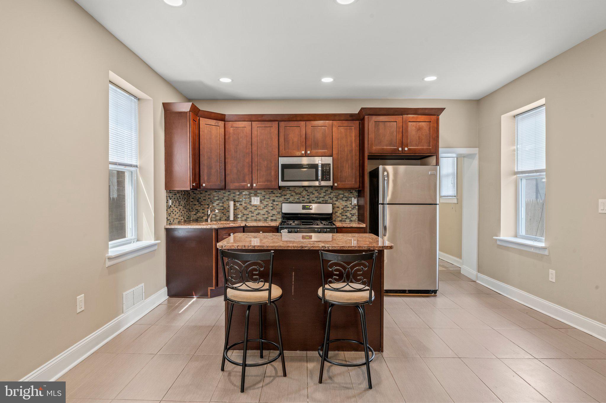 This home is truly a gen in the heart of Philadelphia. Beautiful large single family with a total of 4 spacious bedroom, 2 full bathroom is perfect for family of all sizes. As you step inside you will immediately feel the warmth and charm of this house. Enter into the living room with high ceilings that fills with natural sunlight and leads to the beautiful finish dinning kitchen area. This gorgeous full kitchen is equipped with stainless -steel , appliances including a refrigerator , gas range, dishwasher and microwave. This fully renovated home is convenient for shopping, restaurants and transportation. Commuting is easy from nearby 1-95 and 6 min stroll to Tacony Train Station (Trenton Line) to get to center city or NYC via NJ. Nearby parks include Moss Playground plus the Tacony Branch Library is just a few block away along with the U.S Post office branch. Make your appointment today and live where you love!