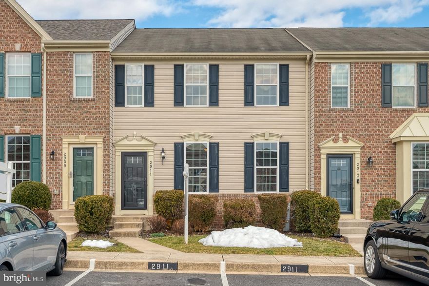 Welcome to 2911 Islay Ct!
This beautiful townhouse in the desirable Monmouth Meadows community is ideally situated on a quiet cul-de-sac and backs to trees, offering both privacy and convenience. The light-filled, open floor plan is perfect for everyday living and entertaining. The updated kitchen with white cabinetry and gourmet appliances is sure to delight the cook in the family. Step outside to enjoy the maintenance-free deck and paver patio—ideal for relaxing or hosting guests.

The upper level features a spacious primary suite with a private owner’s bath, two additional bedrooms, a full hall bath, and convenient upper-level laundry. The walk-out lower level includes a family room, half bath, and a versatile flex space that can serve as a home office, exercise room, or guest area. The HVAC was replaced in 2025, offering additional peace of mind.

Monmouth Meadows residents enjoy access to a community pool, clubhouse, and tot lot, all while being conveniently located near shopping, dining, and major commuter routes.