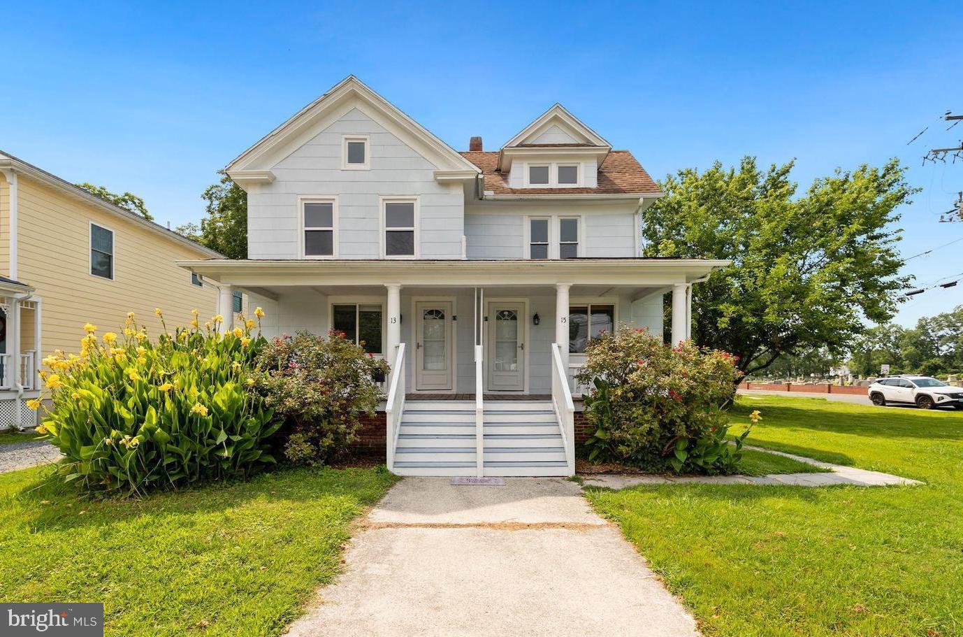 Enjoy the convenience of being located just a short ride or walk from Daughtery Creek of Crisfield in this recently updated Victorian duplex. Unlimited investment opportunities are present with both units of this complex conveying as well as the cleared adjacent corner parcel. Experience many local amenities at the touch of your fingertips including popular seafood restaurants, local boat ramp, Crisfield Library, Crisfield's Wellington Beach, and more. A welcoming front porch is divided between each unit and looks out across North Somerset Avenue displaying lovely greenery views. Unit 13 boasts new luxury vinyl plank flooring and neutral color palette that carry from the generous living room throughout the main level. A stunning updated kitchen features granite counters and stainless steel appliances. A full bath is also present on the main level of this unit. The upper level displays and expansive primary suite with hardwood flooring and a supplemental second bedroom with built-in window seat. Unit 15 invites you into a lovely living room with a neutral color palette accented with hardwood flooring and trim. A spacious dining room allows for ease of gathering around a delicious meal. Beautiful luxury vinyl plank flooring carries from the dining room into the kitchen displaying wainscot and brand new stainless steel appliances. Closet doors pleasantly conceal the washer and dryer. Ascend to the upper level to find two additional newly carpeted bedrooms and a full bath. A rear screened porch provides the perfect place to sip a cup of coffee, soak in the whispering breezes, and enjoy overlooking the rear yard. This unique opportunity provides you the capability of a complete double investment property, the option to live in one unit while renting the other, as well as other alternatives with an added corner parcel with parking easement. This unique and valuable opportunity combines an extraordinary location with beautiful upgrades and the ability for a turn-key, double investment property with multiple different uses. Both units are currently rented, providing a monthly income of $2,850.