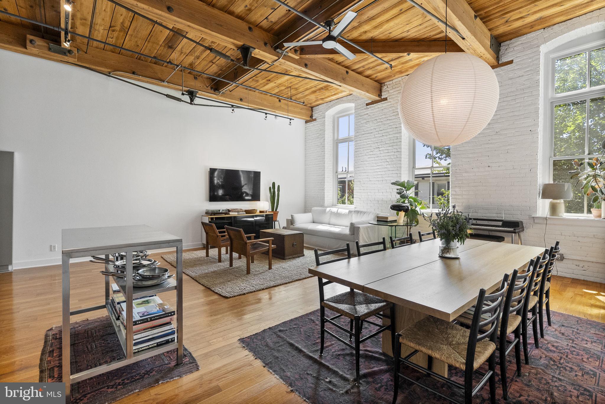 Welcome to Unit 203 at 2551 Trenton Avenue – a beautifully renovated loft in the heart of East Kensington with elevator access, gated deeded parking, and unmatched character throughout.
This spacious 2nd-floor unit offers original timber beams, massive ceilings, and tall factory-style windows that flood the space with natural light all day long. The open concept living space features oak hardwood floors, designer Restoration Hardware light fixtures, and a freshly painted interior for a modern yet warm feel. The renovated kitchen boasts updated appliances, ample cabinetry, and additional storage, while a dedicated laundry room adds everyday convenience. The floor-to-ceiling tiled bathroom includes an oversized walk-in shower, adding a luxurious touch to this unique industrial home. A newly replaced water heater ensures efficiency and peace of mind.
Modern upgrades include a Nest Smart Thermostat System and August Wi-Fi Smart Lock System, bringing both convenience and security to your daily life.
Pet owners will love that this building is pet-friendly and directly across the street from Pops Dog Park. Outdoor enthusiasts will also enjoy having basketball courts and Pops Skate Park just steps away.
Enjoy secure, gated parking with your own deeded spot—a rare find in the city! Ideally located within walking distance to some of Philly’s best local gems, including Meetinghouse, Forin Café, Riverwards Produce, Fiore Fishtown, Picnic, Vestige, Cloud 9 Clay, Philadelphia Brewing, Thunderbird Salvage, and all the eateries and shops along Frankford Ave. Plus, you’re less than a 10-minute walk to the Market-Frankford Line, making commuting a breeze.
Don’t miss the opportunity to own a piece of Philadelphia history with all the modern comforts you could want. Schedule your tour today!