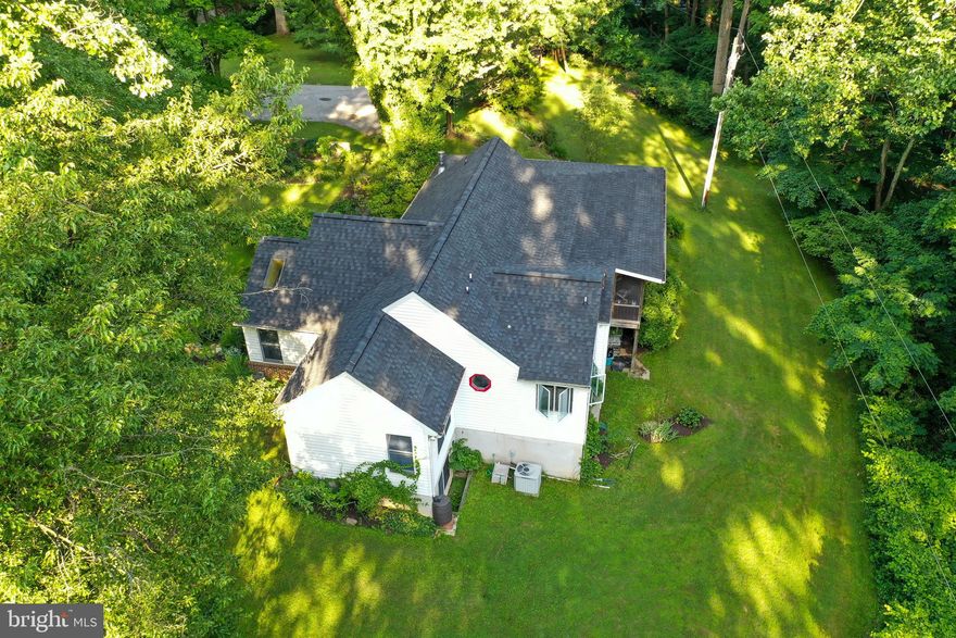 SELLER HAS FOUND HOME OF CHOICE AND IS READY TO MOVE!  PRICED TO SELL!  Amazing opportunity to live in your own private paradise!  Lush landscape embraces you as you meander down the driveway only to arrive at this spectacular home on 3+ beautiful acres of bliss.  This home is charming with views of Mother Nature at her best from every angle.  Living Room, Dining Room, Kitchen, Master Suite with private Master Bath, Bedroom 2, Full hall bath  and Large Screened-In Porch complete the main level.  Bedroom 3, Full bath, private entrance, family room and access to crawl space complete the lower level.  Four stall barn with tack room and lots of room to roam.  This property is a gem and offers the opportunity to expand; or to enjoy the quaintness of the many features this home offers.  Excellent schools, close to major commuter routes and shopping.  This is the perfect place that allows you to feel as though you are vacationing at a country retreat, but so close to many modern conveniences such as shops, banking, restaurants, gas stations and more!