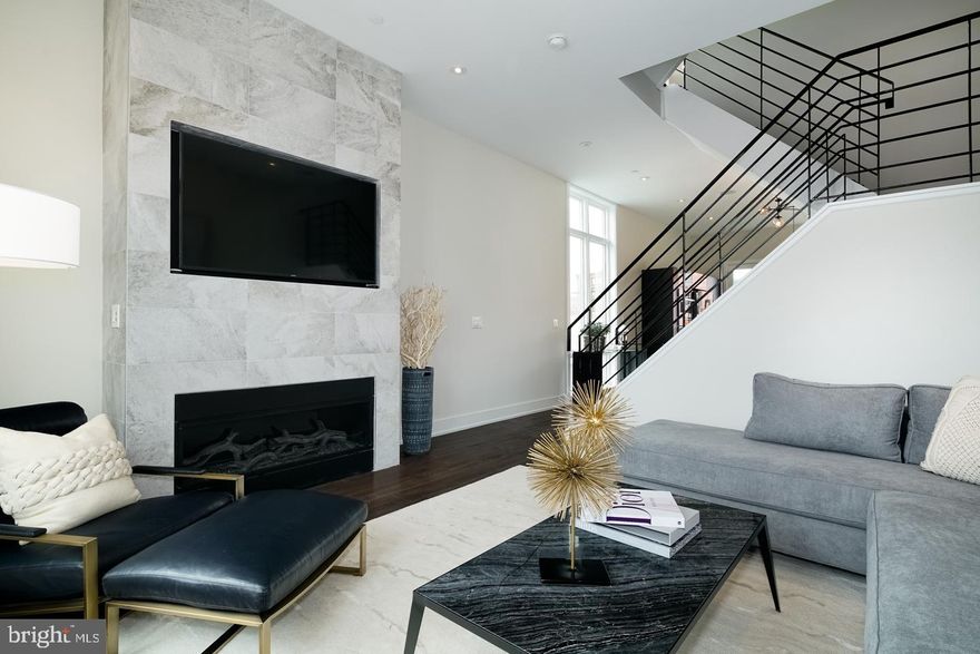 New Construction home in Northern Liberties at Liberty Square. a Phenomenal price with 3 outdoor spaces including a Roof-deck, 2-car PARKING, Rain garden in the courtyard, tax abatement pending, and an abundance of Luxurious space. . Liberty Square Town homes has it all. 3 to 4 bedroom layouts available, still time to chose your own finishes. wide open and extra wide living area, and this magnificent space spills onto a rear deck . The kitchen is spectacular, with high end appliances, custom cabinetry, custom counter tops including a HUGE island and pendant lighting. The extra large floor plan allows for a huge dining area right next to the kitchen. An interior iron railing system runs throughout the home. All of the bedrooms have great space and have ample closets The sleek bathrooms have beautiful fixtures and posh finishes. The master bedroom suite sprawls over an entire floor and has a bathroom that will make you feel as though you are on vacation- permanently! The front facing balconies alternate between the 4th and 3rd levels from house-to-houses. Each bathroom is unique and has only the best materials. The woodwork throughout the home is stunning. Not one inch of space has been wasted. Come visit our 100% complete Model home. Still time to customize the other homes in the development. Pick all of your finishes if you like.  tax abatement!! 2.5 baths come standard, the 3rd full bath in the lower level is an upgrade. Wet/dry bar and and fireplace are upgrade options, not standard. We have A, B and C units available. Interiors and corners.. 618 n 5th street is lot 3