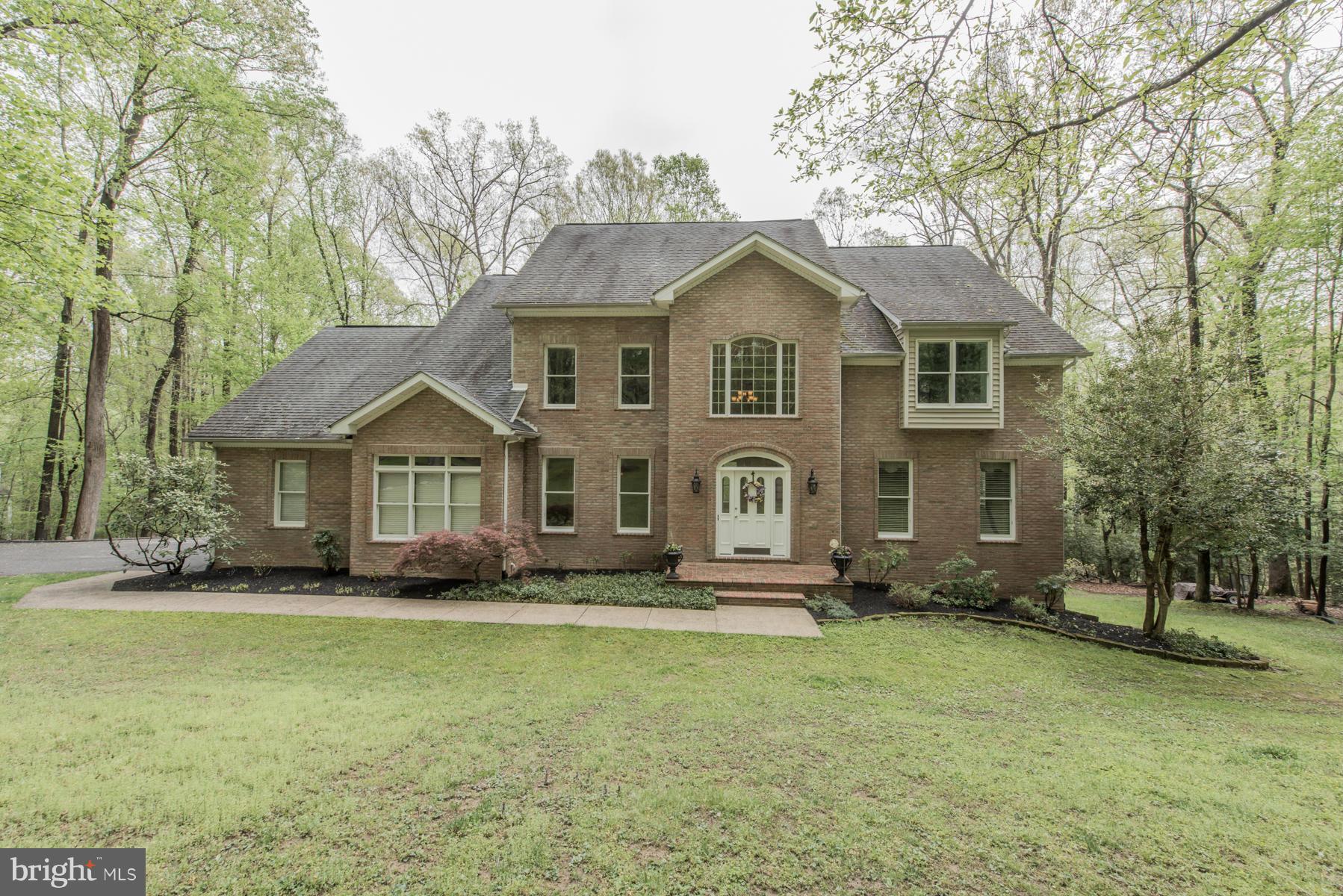 Stunning home offers an expansive open family room with dreamy wooded backdrop. Adjacent SIP accesses elevated deck & boasts panoramic vistas of neighboring Patapsco State Park! Gourmet KIT w/exotic granite. Main level bedroom. Opulent owner's retreat w/huge WIC & luxe bath. Recreation room w/farmhouse-chic knotty pine walls, woodstove, window seats/storage & more!