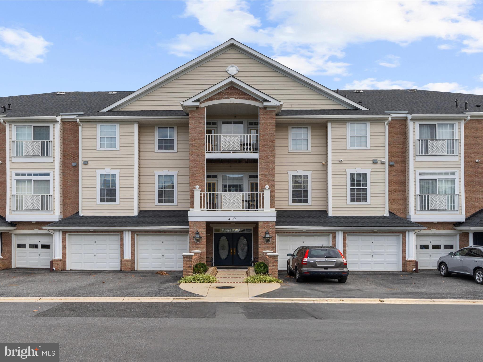 Welcome to your dream home in the heart of the vibrant 55+ community of The Hamlets at South River Colony! This 2-bedroom, 2-bathroom end unit, ground level condo, located at 410 Hamlet Club Dr, Edgewater, MD 21037, offers the perfect blend of modern comfort and low-maintenance living. Spanning approximately 1,652 sq. ft., this residence boasts an open floor plan with 9-foot ceilings and an inviting spacious living room. The primary suite is a true retreat, complete with 2 walk-in closets. It features a luxurious ensuite bathroom with dual sinks, a soaking tub, and a walk-in shower. A second generously sized bedroom and full bathroom provide flexibility for guests or a home office. This move-in-ready condo includes an attached one-car garage with extremely rare interior access to the unit and an additional parking space and convenient elevator access in a secure building. Community Amenities The Hamlets at South River Colony offers an unparalleled lifestyle with resort-style amenities, including: Two community pools for relaxation and recreation Tennis and pickleball courts for active fun scenic walking and jogging paths, a community center, and clubhouse for social gatherings, tot lots and playgrounds for visiting family, optional golf course membership for enthusiasts Secure building entry and extra storage for peace of mind Nearby Shops and Malls Perfectly situated for convenience, 410 Hamlet Club Dr is within walking distance to a variety of popular shops and dining options. Explore local favorites such as: Beautifully Wilde Boutique and The Twisted Bead for unique shopping experiences Black Market Bakers, The Original Steakhouse, and Coopers Tavern for delicious dining, UPS Store and Edgewater Post Office for everyday needs, Giant Food, and CVS Pharmacy for groceries and essentials For larger shopping excursions, the condo is just a short drive from: Westfield Annapolis Mall (approximately 4 miles away), featuring major retailers like Macy’s, Nordstrom, and Apple, along with a wide range of dining options Annapolis Towne Centre (also about 4 miles away), offering upscale shops like Whole Foods, Target, and Anthropologie, plus restaurants such as True Food Kitchen.