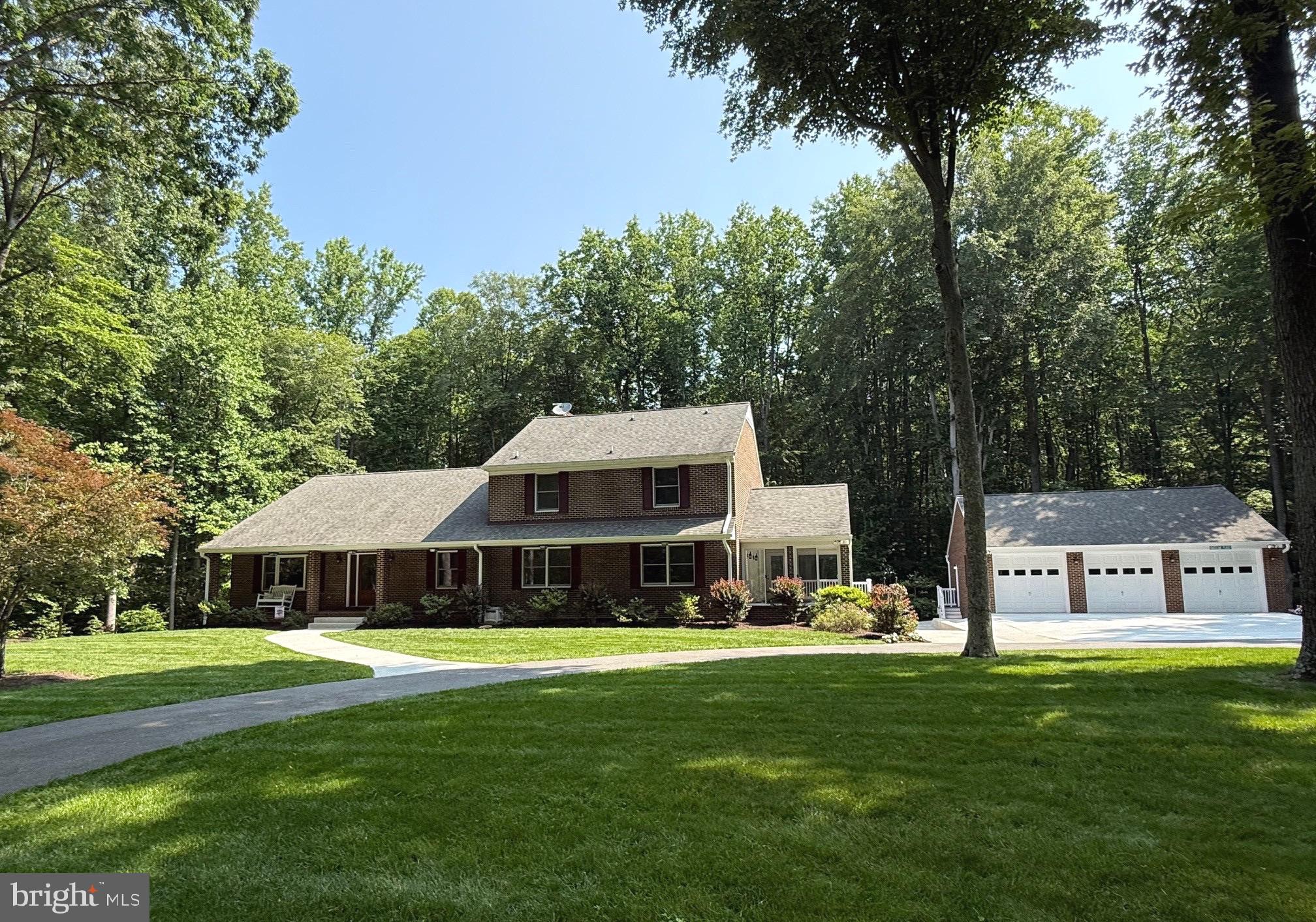 Stunning All-Brick Home on 4.6 Private Acres – A Serene Retreat Between Pax & DC!
Nestled on 4.6 beautifully wooded acres in a peaceful rural setting. This meticulously maintained all-brick residence offers both privacy and luxury with over 4,000 sq ft of versatile living space.
The main level features Brazilian hardwood floors throughout, creating a warm and elegant ambiance. Enjoy the cozy charm of a brick gas fireplace in the great room, which opens to an expansive 80-foot, maintenance-free deck via three new sets of French doors—perfect for entertaining or relaxing with nature views.
With two spacious bedrooms, a dedicated sewing room, and a private office, there’s space for everyone. The formal dining room and sun-filled breakfast room with large picture windows overlook the tranquil backyard, while the sunroom offers a quiet spot to enjoy every season.
The upper-level master suite is a private oasis of 900 sq ft, a second fireplace, and access to a secluded balcony—your personal retreat.
The basement includes a finished craft room and a second private office complete with a built-in safe. You'll also find 1,700 sq ft of unfinished space with high ceilings—ideal for a home gym, workshop, or future expansion.
Additional highlights:
All new exterior doors & freshly painted interior
Resurfaced concrete parking pad & sidewalks
Three-car garage with built-in cabinets and workbench
Conveniently located between Patuxent River (Pax) and Washington, DC
This one-of-a-kind property offers the perfect blend of rural tranquility and modern convenience. Don't miss your chance to own this beautiful retreat!