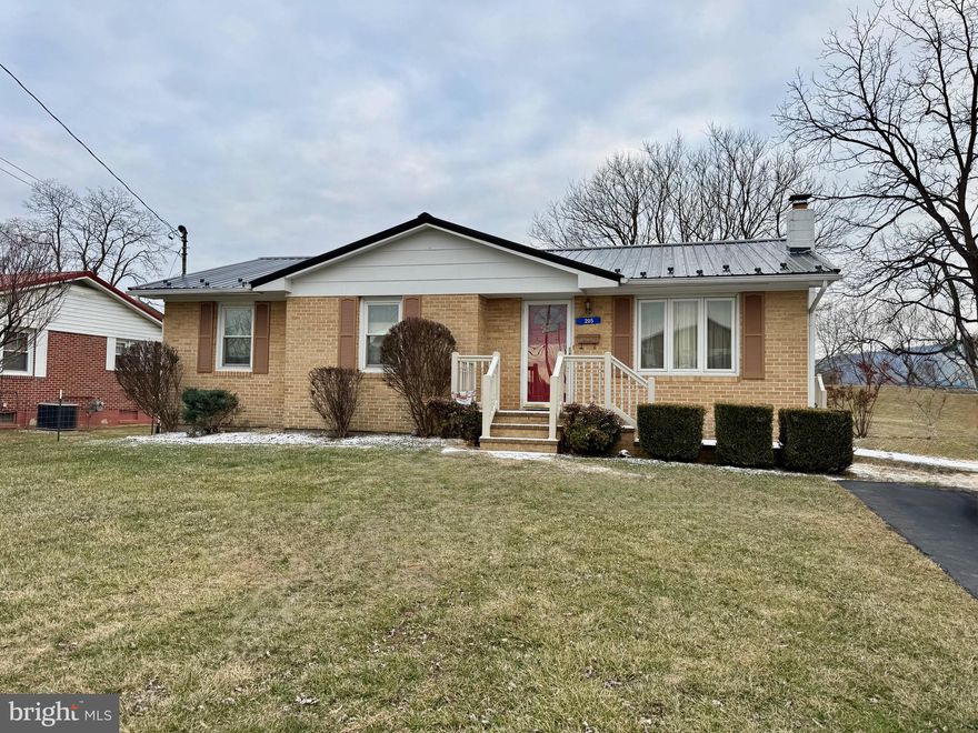 Charming brick front home in the heart of Moorefield. This 3 bed 2 bath house has all the convenience of town living with the privacy and protection of the river levee. This property backs up to the levee, letting you enjoy your nice flat back yard while being out of the flood plane! The fully finished basement helps expand your living space! It is the perfect family room, game room, man cave, or craft room. This home has endless possibilities. You don't want to miss this one!