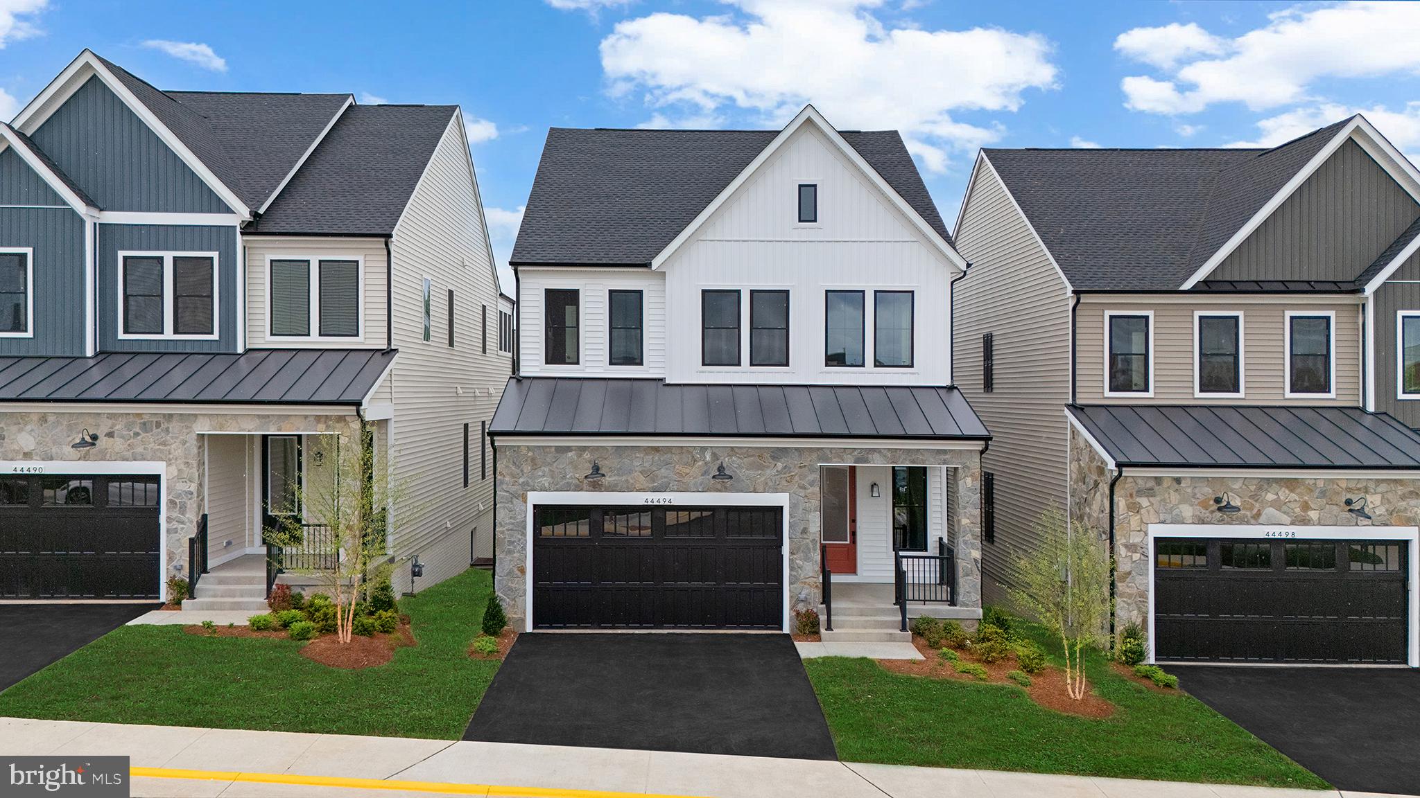 Say hello to your new dream home! This brand-new incredible ACTIVE ADULT (55+) SINGLE-FAMILY HOME by Van Metre Homes at LEXINGTON SQUARE is currently under construction and ready to move in almost IMMEDIATELY! The SCOUT 30-F2 floorplan is a masterfully engineered home offering over 4,000 square feet of finished elegance across 3 levels featuring 4 bedrooms, 3 full and 1 half bathrooms, and a 2-car, front-load garage, providing ample space for your personal lifestyle. As sunlight floods through expansive windows, the main level welcomes you with soaring 10' ceilings and a sophisticated open floorplan, crafting an inviting and spacious atmosphere ideal for both unwinding and maximizing productivity. For those who love to entertain, the heart of the home awaits in the signature gourmet kitchen, boasting an oversized center island, upgraded cabinets, quartz countertops, stainless-steel appliances, and luxury vinyl plank flooring. Whether you're hosting intimate gatherings or preparing family feasts, this space caters to your every culinary need. The main level primary suite features a chic bathroom complete with an oversized frameless shower featuring a built-in seat, ensuring relaxation after a long day. Ascending to the upper level, two additional bedrooms await alongside a fabulous flex/retreat space, offering versatility to your space. Enjoy a finished basement complete with another bedroom, bath, and additional storage to support your unique lifestyle. But that is not all! Picture yourself soaking in breathtaking sunsets and entertaining g energy efficiency standards, comes with a post-settlement warranty, and has never been lived in before! Don't miss the chance to experience the height of contemporary living in this floorplan. Schedule an appointment today! ----- Located in Northern Virginia, Lexington 7 is an Active Adult (55+)community that offers townhomes and spacious single-family homes. Residents benefit from its close proximity to One Loudoun’s restaurants, shopping, movies, and community events. With just 23 homes, this small and intimate community offers the perfect balance of privacy and convenience, allowing you to enjoy your own space. The neighborhood is complete with a bocce ball court and walking trail, along with a gym membership for the first year at Method Health Club just steps away. Additionally, Lexington 7’s convenient location places it close to the Metro’s Silver Line, Dulles International Airport, commuter routes, and health centers, making it a prime destination for those seeking a well-connected and vibrant lifestyle. ----- Take advantage of closing cost assistance by choosing Intercoastal Mortgage and Walker Title. -----Other homes sites and delivery dates may be available. ----- Pricing, incentives, and homesite availability are subject to change. Photos are used for illustrative purposes only. The community lies within the Airport Impact Overlay District. Due to its proximity to Dulles International Airport, this site is subject to aircraft overflights and aircraft noise. For details, please consult the Community Experience Team.