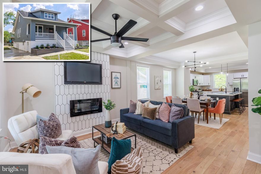 METICULOUSLY RENOVATED HOME WITH OVER 2,000 SQ. FT. OF LIVING SPACE!  This home has it all!  Open floor plan featuring hardwood floors, spacious living room w/ coffered ceiling and fireplace, separate dining area w/ crown molding, incredible island kitchen w/ Quartz counters & ss appliances, main level Master suite w/ walk-in closet and full bath, upper level w/ 3 bedrooms and 1 full bath, fully finished basement w/ a family room, 5th bedroom, and 3rd full bath, front and rear porches, a large fenced yard, and driveway parking!