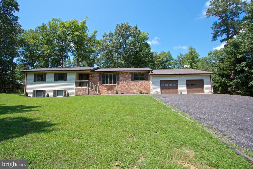 Searching for a one level home with an attached separate entrance  in-law suite?  Look no further!  Hardwood flooring, open floor plan with a massive two car garage  with plenty of room for a workshop and storage as well!  The in-law suite has a mini kitchen, full bath, separate bedroom and living/dining combo area with it's own washer/dryer hook up as well so no sharing necessary!  Callaway is a convenient place to live.  This home is in walking distance to the grocery store, local eats, a cigar bar, local veterinary clinic, tanning salon, nail salon and more!