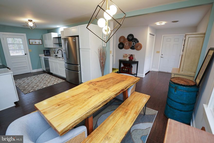 Updated and Upgraded - This lovely 3BR/2BA home on 1+ ACRE features attached and detached garages, and has been transformed for its new owner! New septic, new architectural-shingle roof, new handsome and durable LVP flooring throughout, gorgeous new fixtures throughout, new kitchen, new baths, new ceiling fans, fresh paint throughout, new front door. Wide open, flexible floorplan. Spacious living room opens into the dining area. Dreamy new kitchen - high-end Frigidaire Gallery stainless steel appliance package, soft-close cabinetry - including a large pantry cabinet - upgraded granite, custom backsplash and oil-rubbed bronze faucet over the deep sink. Primary bedroom w/brand new attached bathroom - tub/shower combo, new stylish vanity, LVP flooring - and sliders to patio overlooking the expansive yard. Bedroom 2 also features a new ceiling fan, new LVP floors, oversized closet and flex space that could be a mini-office, dressing area, reading nook. Bedroom 3 - new ceiling fan, new LVP floors. 2nd full bath w/tub/shower combo, LVP flooring, new vanity, corner linen closet. Laundry room w/new washer and dryer included. Attached 1-car garage, detached oversized 1-2 car garage w/workshop area and lots of storage. Great location with a country feel, but just a couple miles to Rt 13 and the Bypass. Minutes to big box stores and popular chain restaurants, or enjoy unique shopping, dining, and events in Fruitland, Downtown Salisbury, or Historic Downtown Princess Anne. About 8 minutes to Salisbury University, about 10 to UMES - and of course 40 minutes to Ocean City! Sizes, taxes approximate