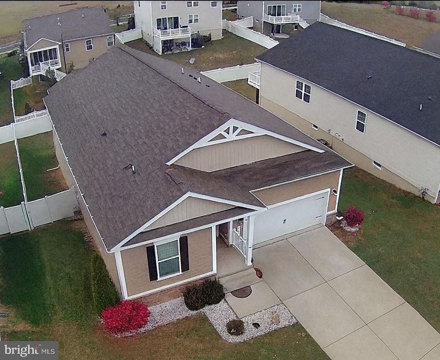 Deceivingly large home with over 3,300 finished square feet of living space and has a flexible layout designed for space and comfort. Conveniently located near I-81 and minutes to I-66, this five-bedroom, three-bath property offers room for large families, multigenerational living, or home offices. The open main level includes three bedrooms and two full baths, highlighted by an owner’s suite with dual vanities, tiled shower, and walk-in custom closet. The finished basement adds two more bedrooms, a full bath, and a large recreation room with walkout access to a covered stamped-concrete patio and fully fenced yard. Updates include GE Café appliances, quartz countertops, EV-charger wiring, and fresh paint throughout. Outdoor spaces feature a covered Trex deck with mountain views and a porch swing. Ample storage and a two-car garage complete this spacious, move-in-ready home.