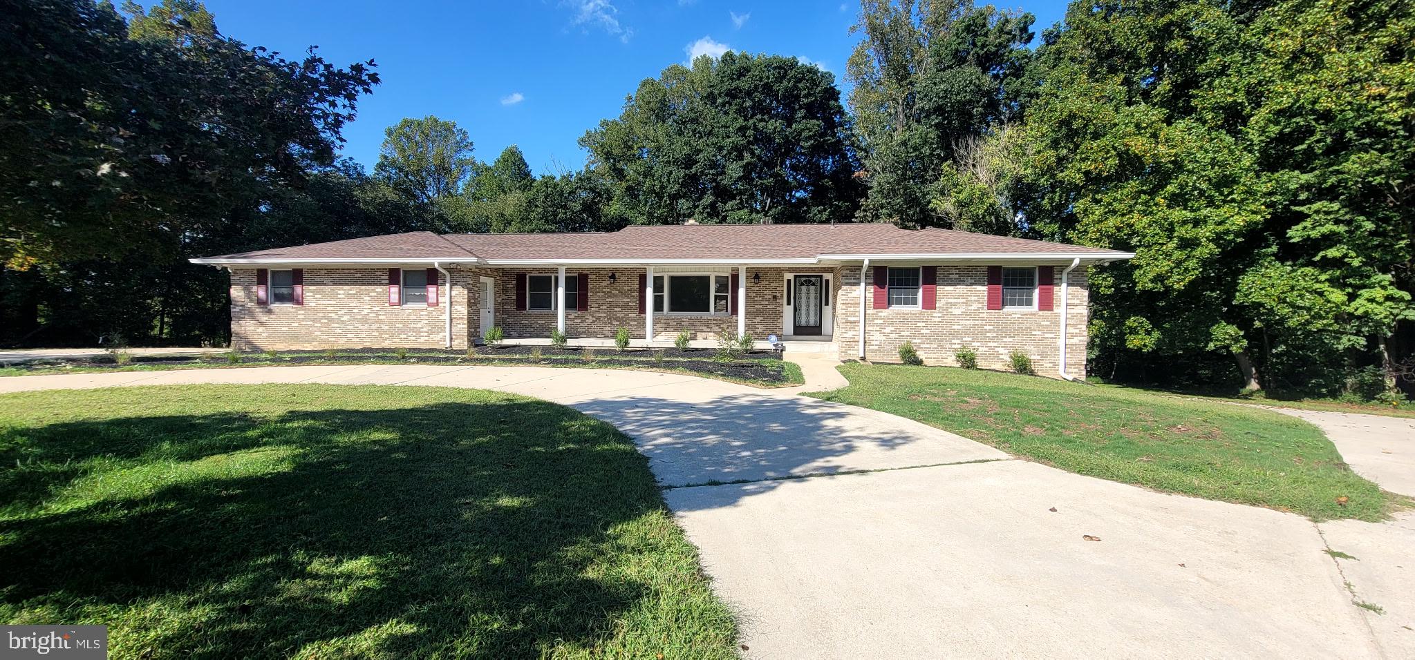 Location, Location, location! Beautiful Calvert County, MD is Washington DC’s best kept secret. Surrounded by the Chesapeake Bay and Patuxent River, country living and open spaces define Calvert County. And if you’re looking to discover your private oasis while needing to commute to DC, Annapolis, Andrews AFB, or having access to the beltway, this is it! Located at the northernmost part of Dunkirk right off of Route 4, this unique two-level, custom ranch-style home is situated on a generous 3.11-acre lot at the end of a quiet cul-de-sac in the sought-after, non-HOA Springfield neighborhood of Dunkirk. The home combines classic charm with expansive living spaces, both indoors and out, creating the perfect retreat. The home's enduring all-brick exterior offers a timeless classic aesthetic and welcomes you into a spacious interior. The main level provides the convenience of a traditional ranch layout, while the finished basement nearly doubles the home's functional square footage. The home includes an auxiliary whole-house wood-burning stove as well as a beautiful, multi-tiered screened back deck extending your living space into the lush, private backyard, providing an ideal setting for outdoor dining, entertaining, or simply enjoying your morning coffee. The full, finished basement offers endless possibilities. Use the versatile space as a secondary living area, recreation room, home gym, or guest suite. It also provides ample storage for all your needs. Prospective contractors will appreciate the over-sized garage, double circular driveways, as well as the ample covered parking that is completely secluded from public view. And if schools are a consideration, Calvert County has an “A”-rated public school system. Surrounded by mature trees, cute red fox, and an array of singing birds, the sprawling lot offers privacy and plenty of room for gardening, recreation, or simply taking in the natural beauty of your surroundings. Oh, and if you like figs, you're in for a treat with the mature fig trees that produce delicious figs right outside your door. And if you like to fish or just being able to enjoy the natural beauty of being near water, the property backs up to a lake that feeds into Lyons Creek and is viewable from your home once the leaves have fallen. And the Fall leaves provide a spectacular backdrop in your own backyard. This home is just a short drive to shopping, dining, multiple beaches, amenities and Dunkirk’s Town Center. For commuters wanting to live in Calvert County, the location doesn’t get any better. Don't miss the opportunity to own this exceptional property that offers both a peaceful, private lifestyle and convenient access to everything you need. This home is ready to become your sanctuary.
