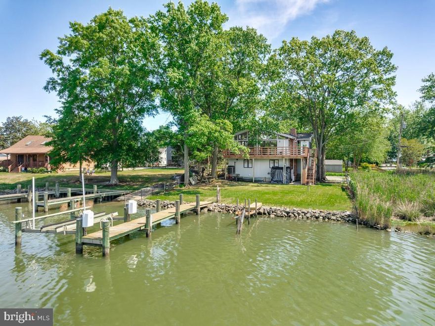 Experience the ultimate waterfront lifestyle on picturesque Carrs Creek with direct access to the breathtaking Chesapeake Bay. This exceptional property features 60 feet of pristine shoreline complete with a private pier and an impressive 8,000-pound boat lift — truly a boater’s paradise. Rebuilt in the late 1990s and thoughtfully updated throughout, the home combines timeless coastal charm with modern improvements including a new roof, new skylights, and fresh paint throughout. Inside, the light-filled main level showcases soaring ceilings and an incredible wall of windows designed to capture the stunning panoramic water views from nearly every angle. Whether you’re entertaining guests, enjoying peaceful mornings by the water, or setting out for a day on the Bay, this home offers a lifestyle that feels like a permanent vacation. Perfectly situated just an hour from the Washington, D.C. metro area, this remarkable waterfront retreat delivers the ideal blend of privacy, recreation and convenience. Rarely does an opportunity like this come along to own a true Chesapeake Bay escape. Don't forget your crab pots!