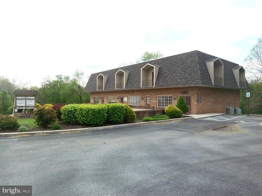 Attractive brick professional building with 1436 SF available at $2393.33 per month which includes $191.47 per month for all utilities. Entry/Sitting area, 7 offices, 2 bathrooms + 1 shower, kitchen,and ample parking,, Previously used as Doctor's office, and remainder of furnishings can stay if desired.  Located on ground floor and well located off Dual Hwy minutes away from Meritus, I70 and more.