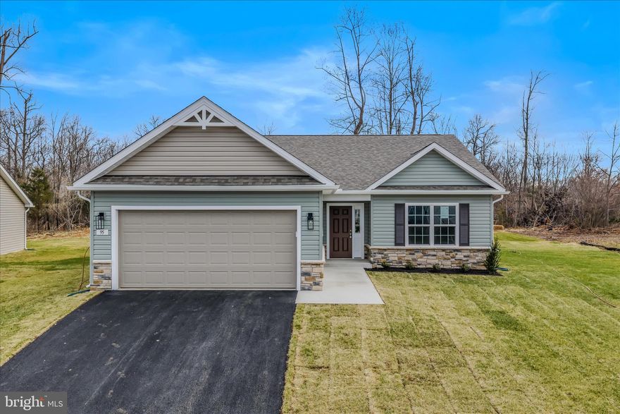 Experience exceptional single-level living in The Lakes at Martinsburg, one of Berkeley County’s desirable new home communities. This brand-new single level home features  approximately, 1,650 finished sq. ft of living space, a spacious 2-car garage, and a beautifully flat .25-acre lot—perfect for easy outdoor enjoyment. Inside, you’ll find 3 bedrooms, 2 full bathrooms, and a dedicated laundry room with upgraded cabinetry for organized storage. The kitchen showcases upgraded white cabinetry, durable quartz countertops, and modern LVP flooring throughout—no carpet anywhere, offering low maintenance and high style. The covered rear patio extends your living space and is ideal for relaxing or hosting gatherings.
Located on the north side of Berkeley County, WV, this home offers excellent convenience for Maryland commuters, with quick access to major routes and everyday amenities. Enjoy the added advantage of lower West Virginia real estate taxes compared to Maryland, making this an appealing option.
Community amenities are a true highlight, including a fenced-in dog park, a fenced playground, and a covered pavilion picnic area—perfect for outdoor leisure, fresh air, and year-round enjoyment.

Special Incentive: The builder is offering closing cost assistance when using the preferred lender. (Borrowers must qualify.)