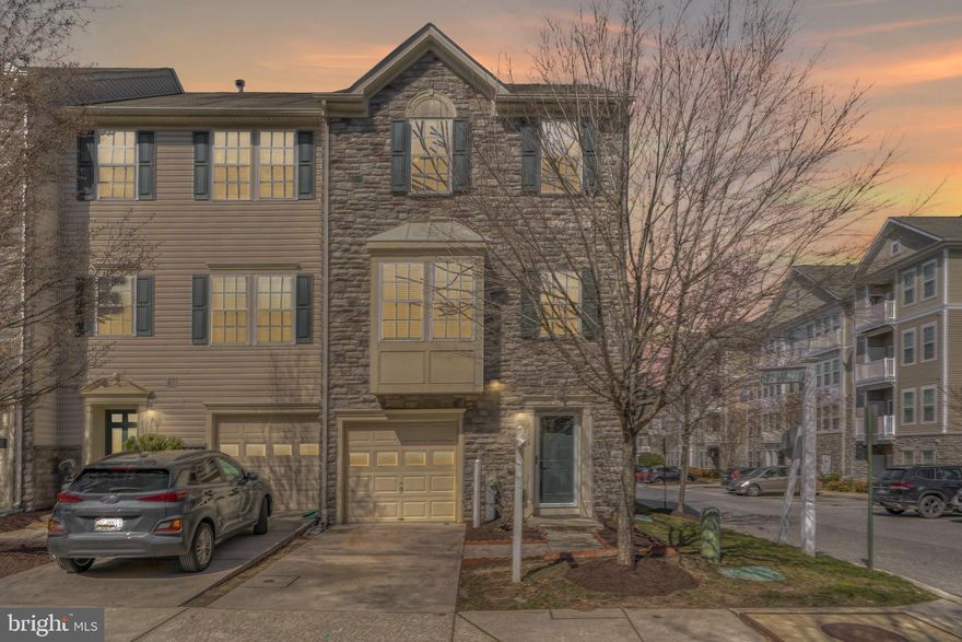 Back on market - Freshly Painted beautiful end unit townhome with 3 bedroom, 2 full bath, 2 half bath and 1 car garage nestled in the desirable community of Belmont Station lovingly. Open floor plan with numerous upgrades. Entry level offers bonus rec room/home office space alongside generous storage. Walk up to your main living level featuring a gourmet kitchen with stainless appliances, granite counters and ample cabinetry. Central island along with dining table space. Dual living spaces flank the kitchen offering a wonderful space to entertain or optional spaces for work/schooling at home. Upper level with a spacious primary bedroom with walk in closet and private super bath along with 2 additional bedrooms and a second full bathroom.  Enjoy the sunset from the comfort of the composite deck, overlooking community green space for convenience. This home has everything that you have been searching for and so much more! Simply perfect! Community club house, gorgeous pool, walking trails, playground and close to major commuter routes.