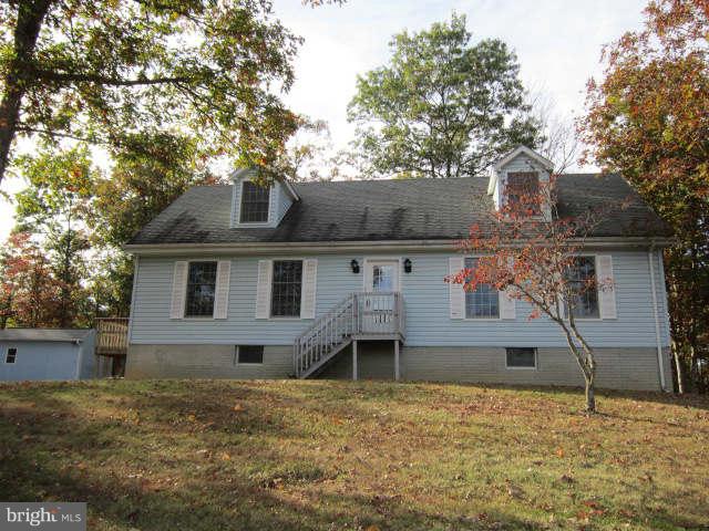 Lovely Cape Cod with mountain views that seem to go on forever, surrounded by tree's gives you a private setting. Large rear tiered deck is great for entertaining. Minutes to the Berkeley Springs State Park with historic warm mineral springs are visible in the largest display of water among Blue Ridge spas and the Cacapon State Park with 6000 acres that allows miles of enjoyment